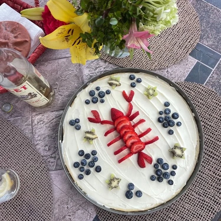 Summer fruit dessert shaped like a lobster