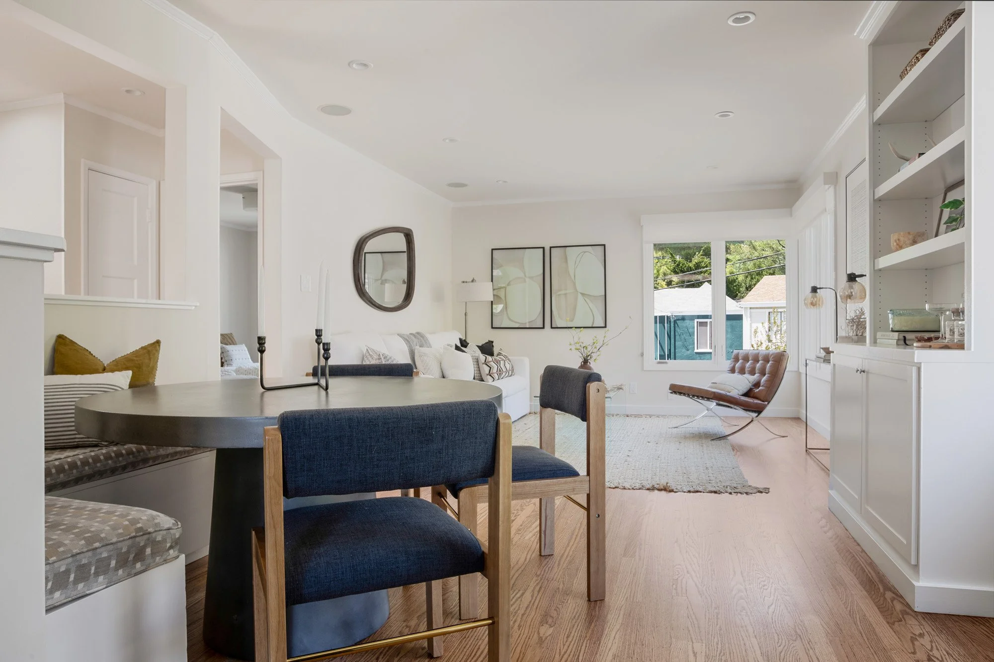 Modern front entryway featuring a slate tile path, minimalist address numbering, and professional drought-tolerant landscaping.