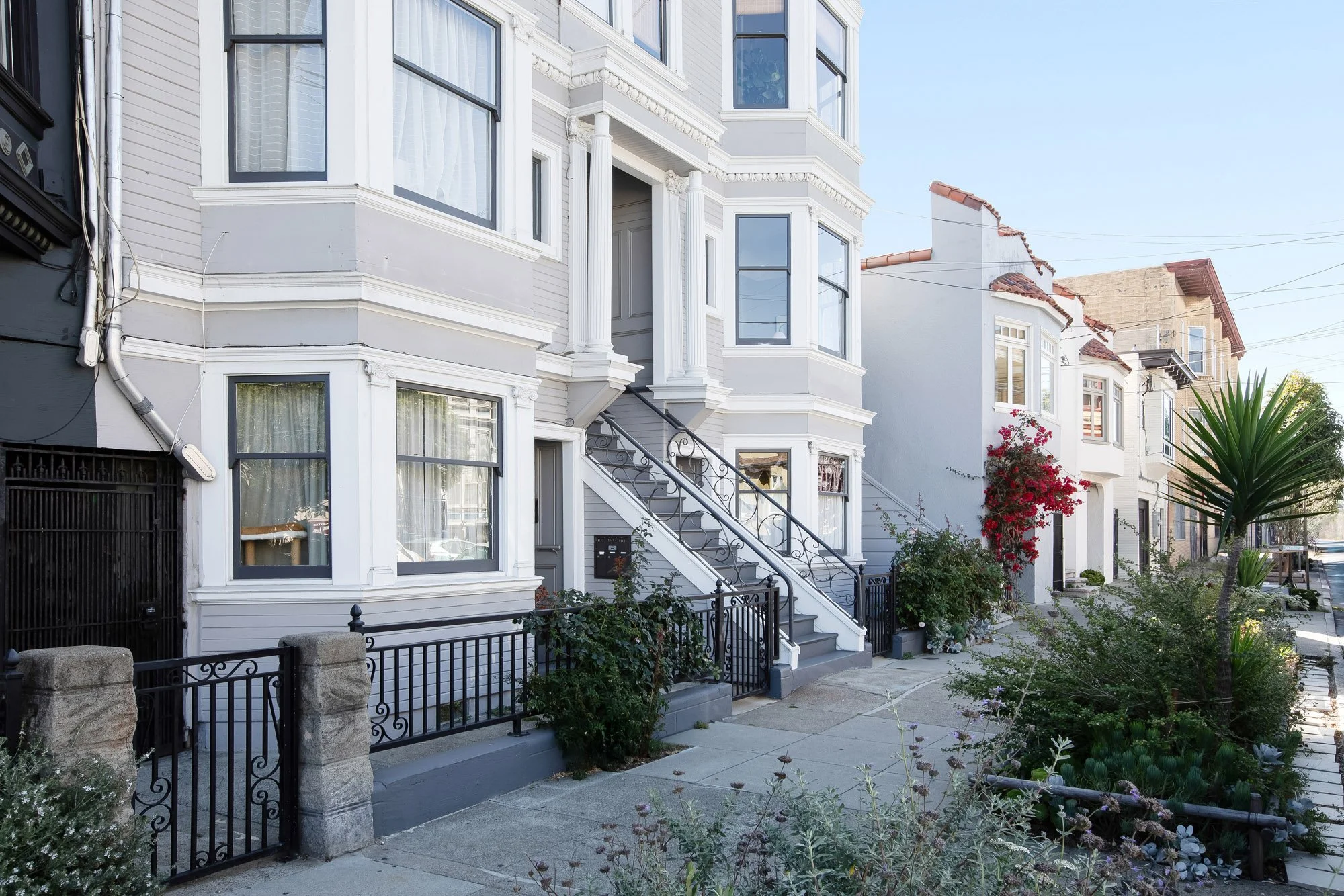 Edwardian building exterior on Alabama Street with bay windows and an exterior staircase leading to the front entry