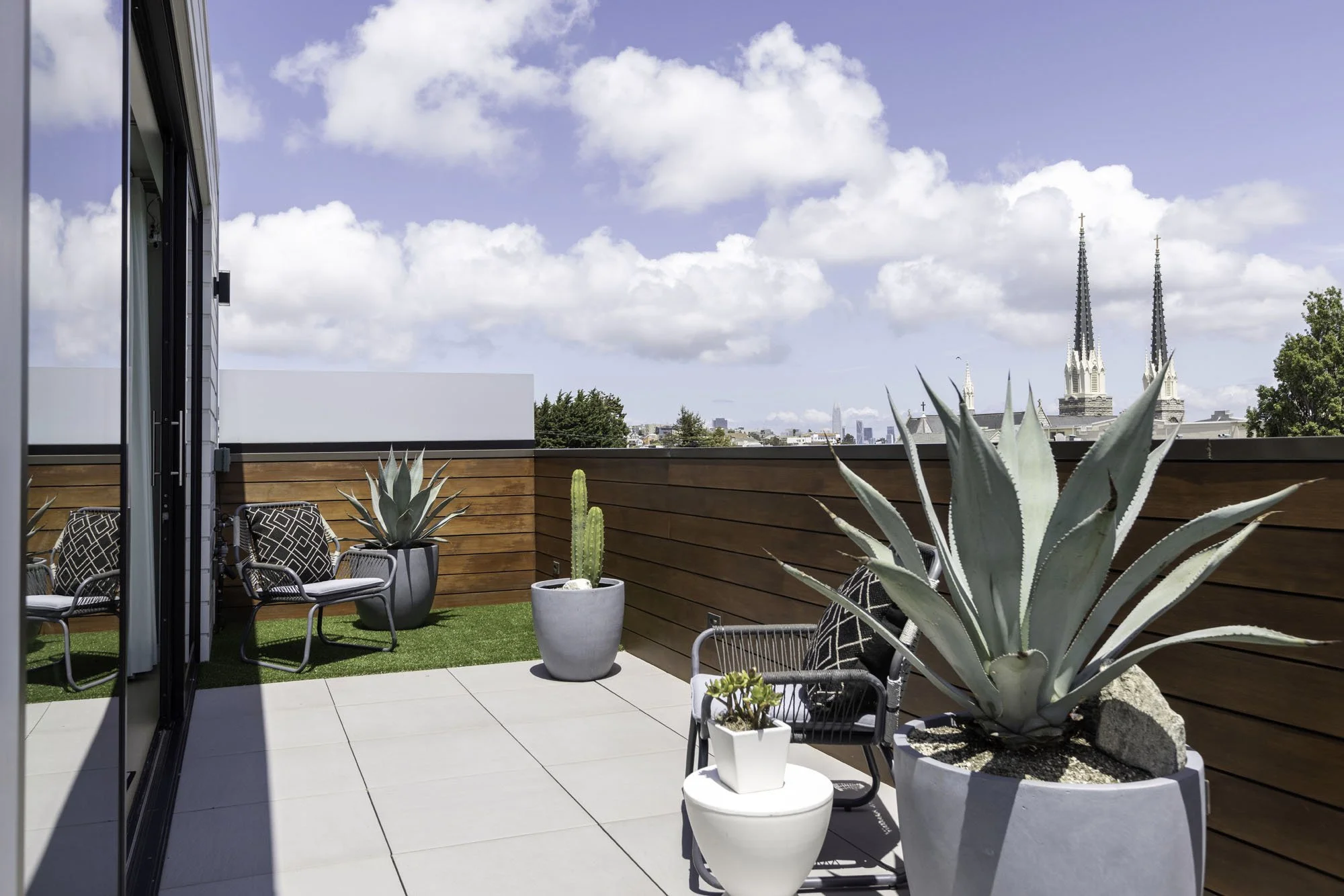 Private roof deck at 1647 Sanchez offering panoramic views of the Mission Dolores church steeples and the San Francisco city skyline.