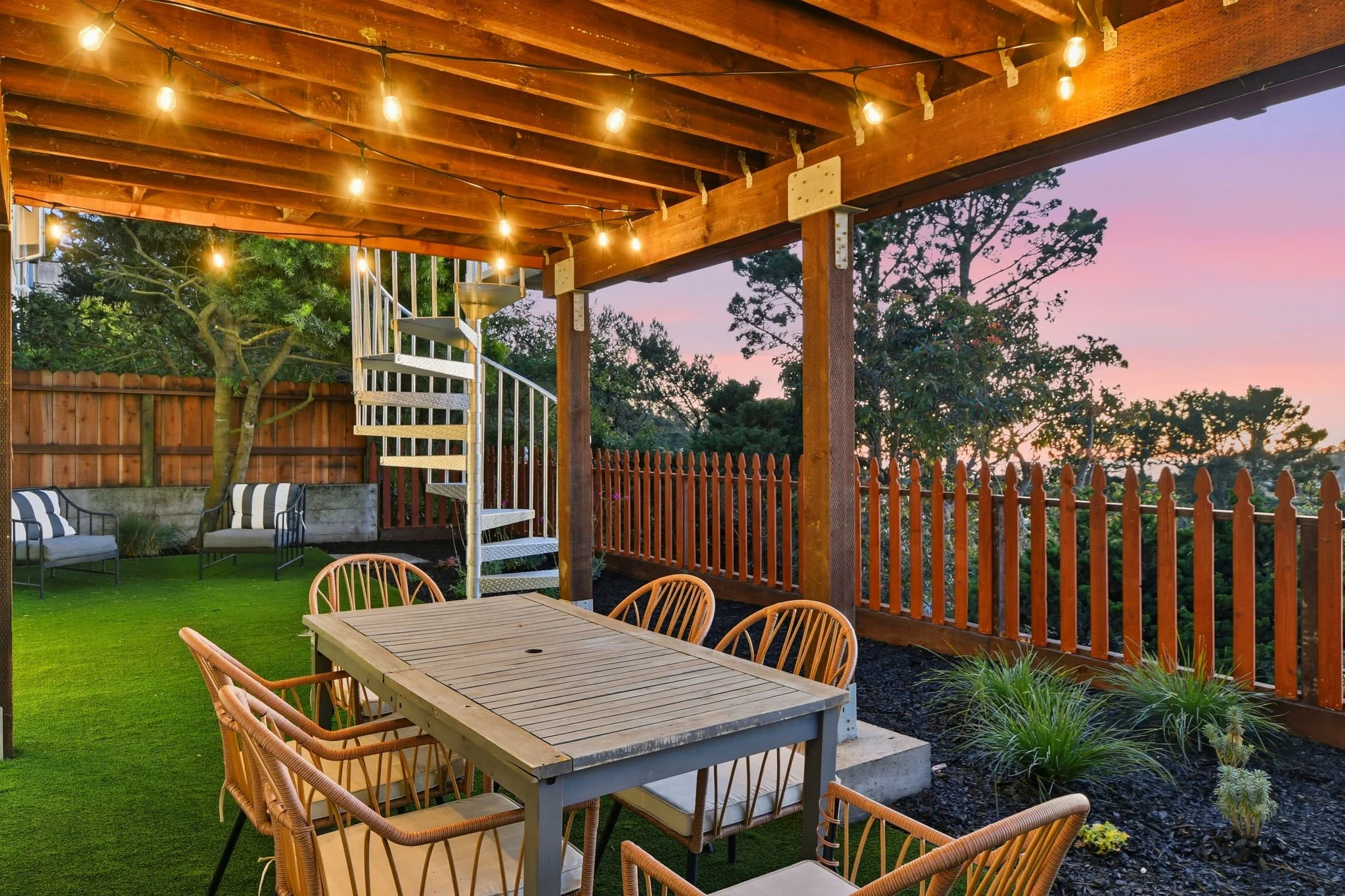 View of outdoor dining table 75 Knollview Way at twilight