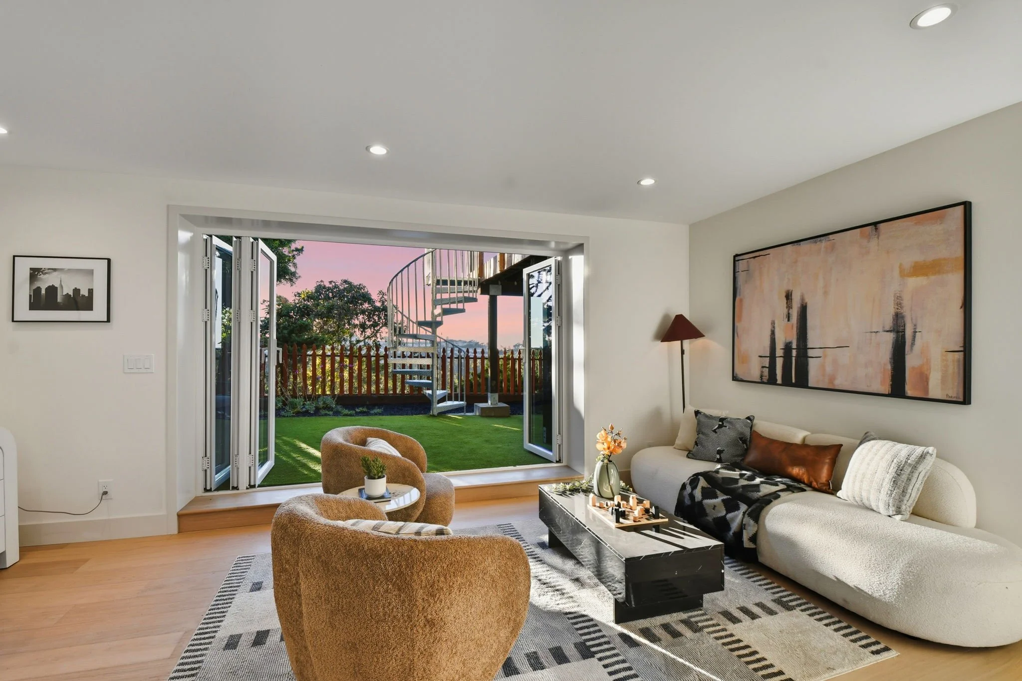 Sunset view of lower den with open doors 75 Knollview Way