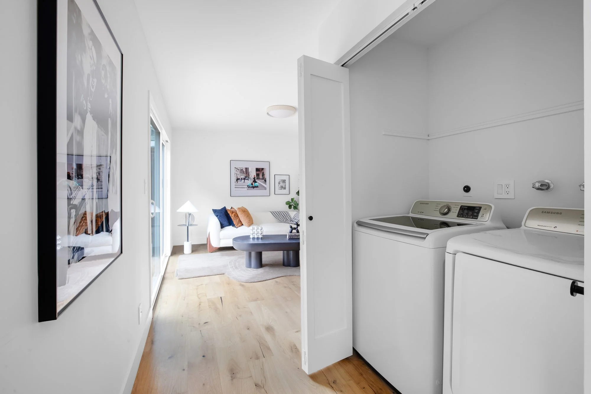 Main-level laundry closet at 75 Aloha Avenue in Golden Gate Heights, with the bonus room and its slider to the rear yard beyond.