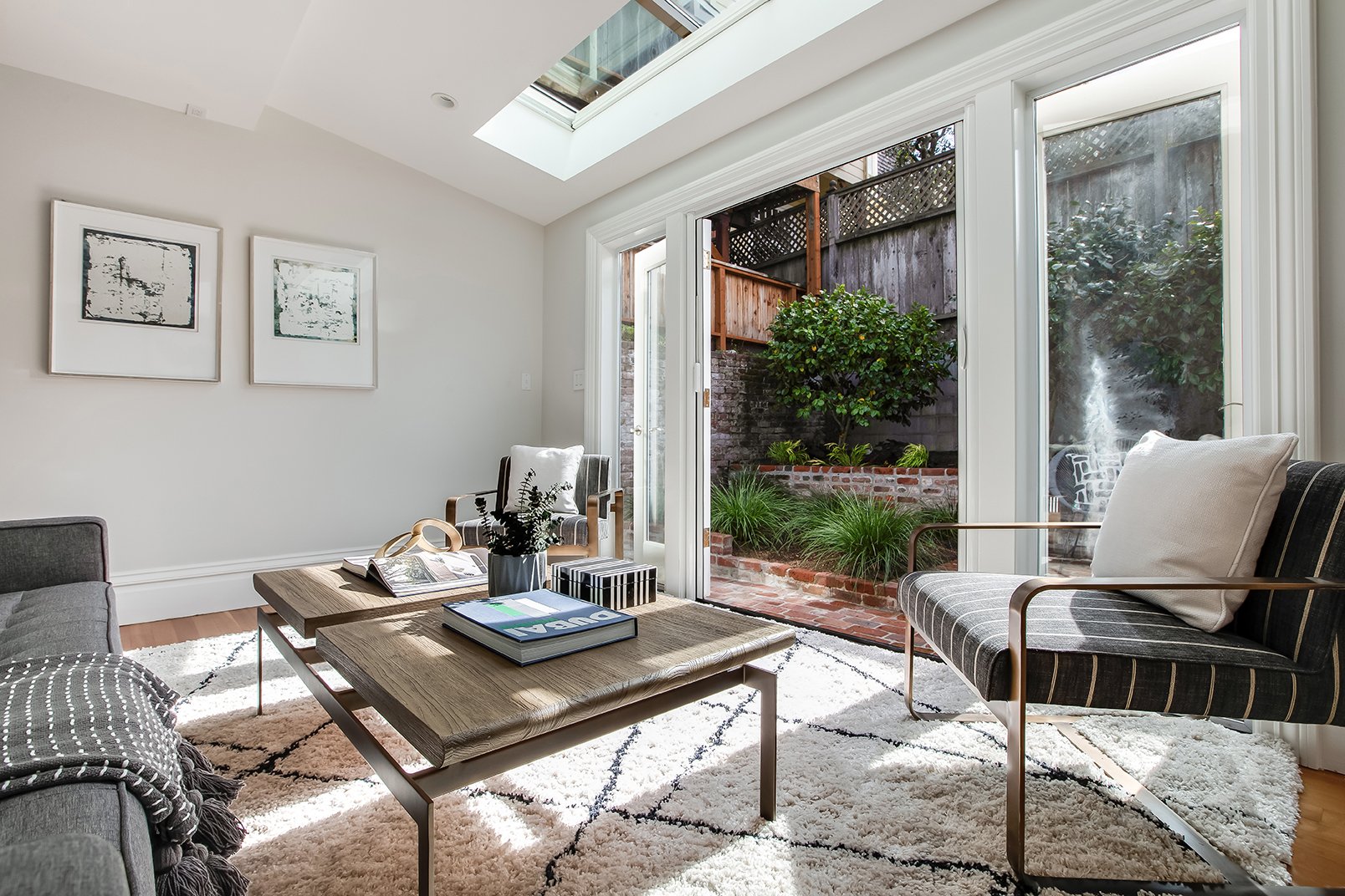 Sun-filled living space highlighting the seamless indoor-outdoor flow of this renovated $3M San Francisco residence.