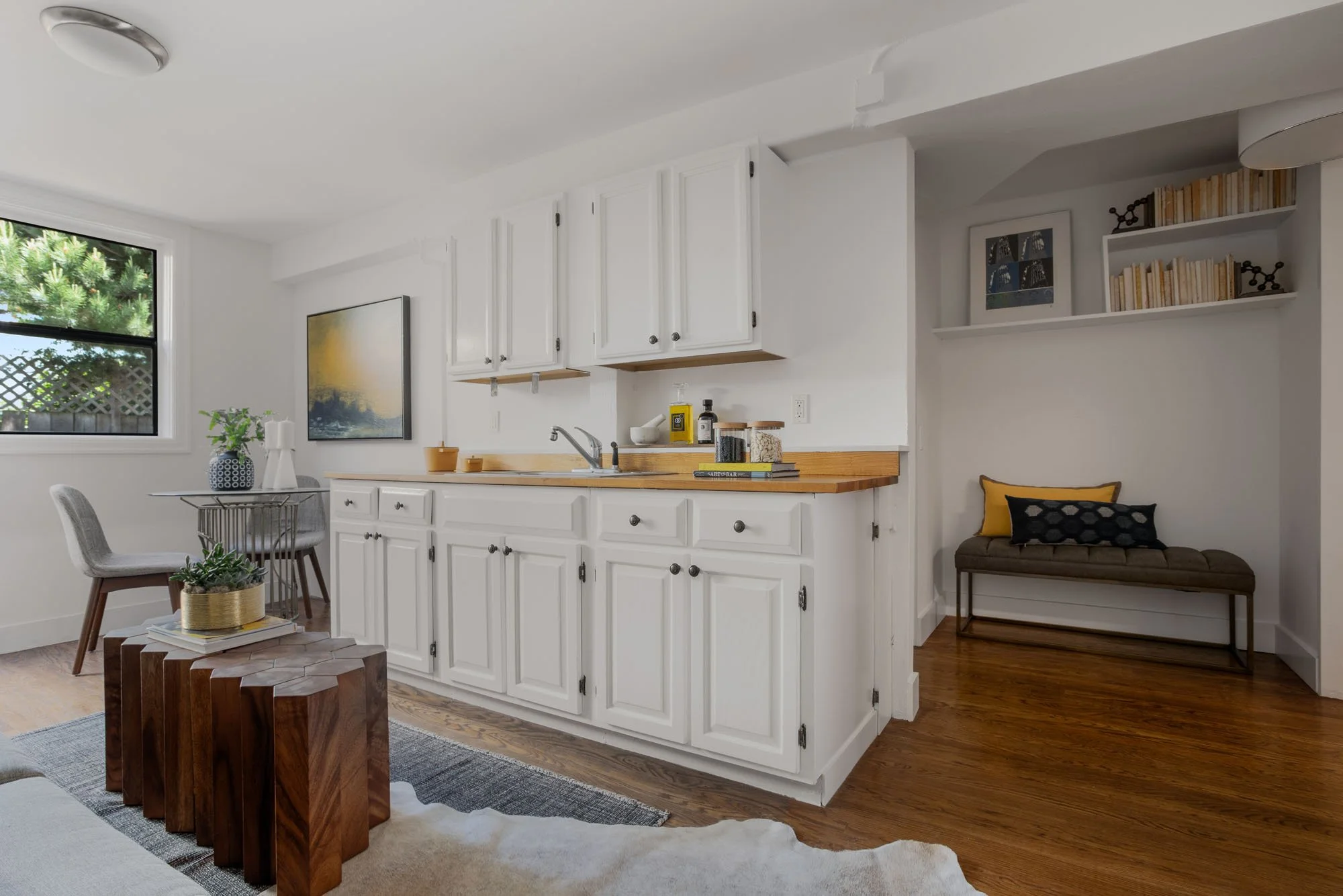 Multi-functional lower-level suite featuring a kitchenette with butcher block counters and a cozy reading nook.