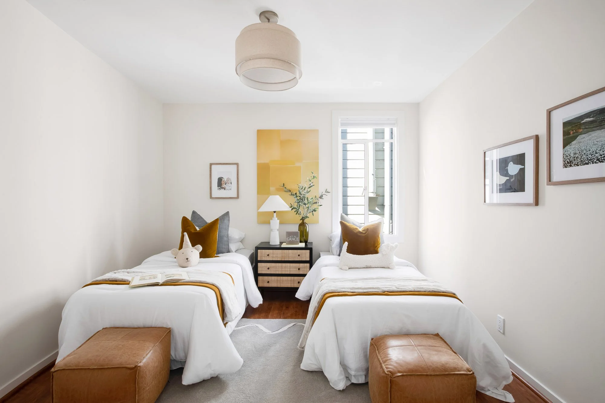 Bedroom at 465 30th Street in Upper Noe Valley with hardwood floors and a tall window bringing in natural light