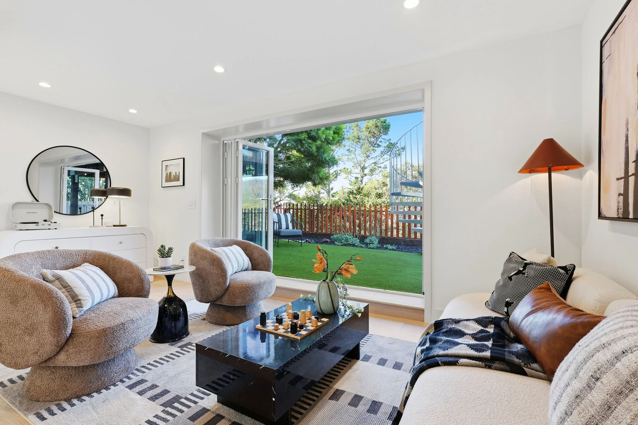 View of downstairs den with open doors to backyard 75 Knollview Way
