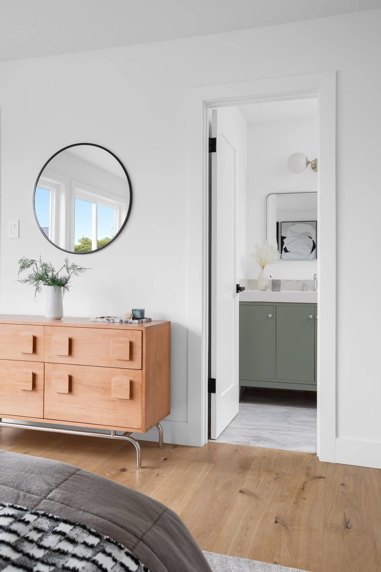 Primary bedroom at 75 Aloha Avenue, San Francisco, opening to an updated ensuite with a green vanity and marble-look flooring.