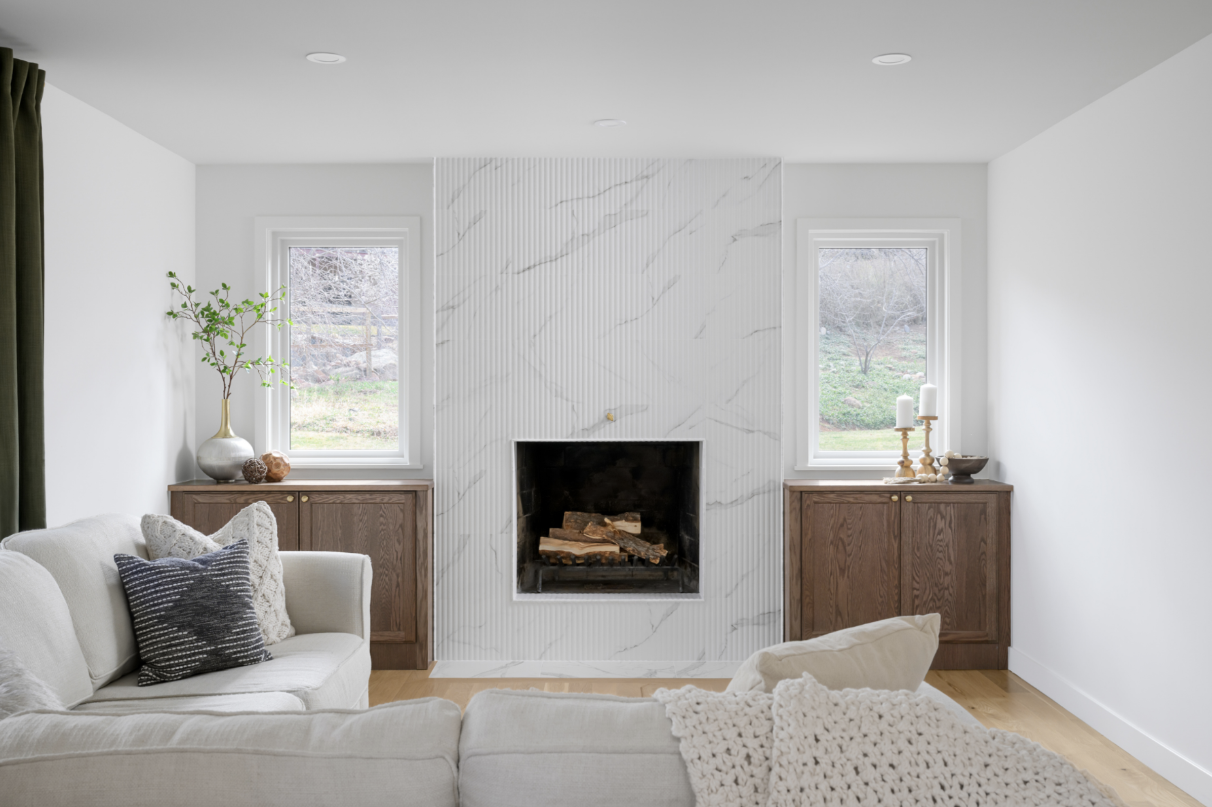 After: We added to fixed windows to the fireplace wall