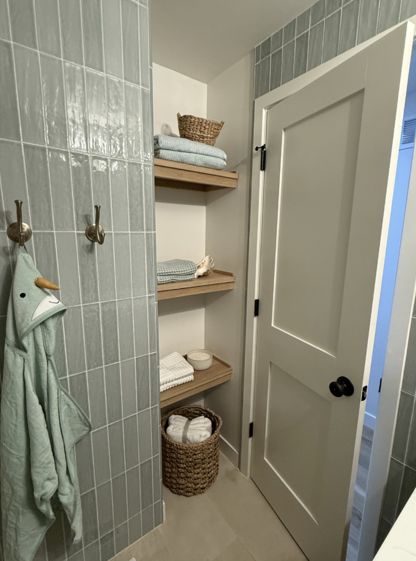 After: Additional storage for towels and a hamper