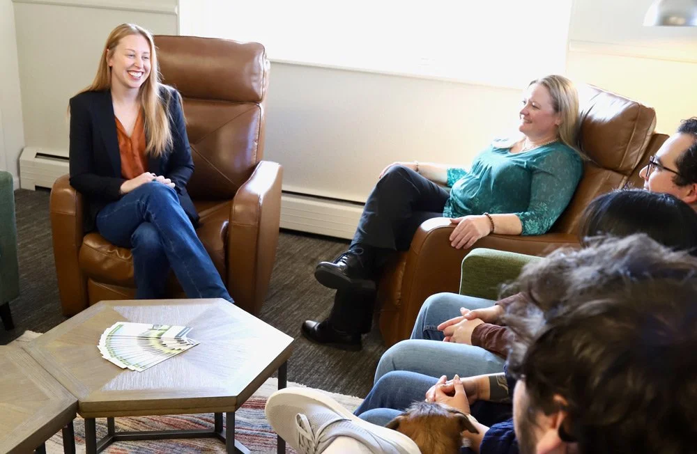 Group of clients seated in a therapy circle, highlighting the supportive environment of group therapy services in Denver & Littleton, CO