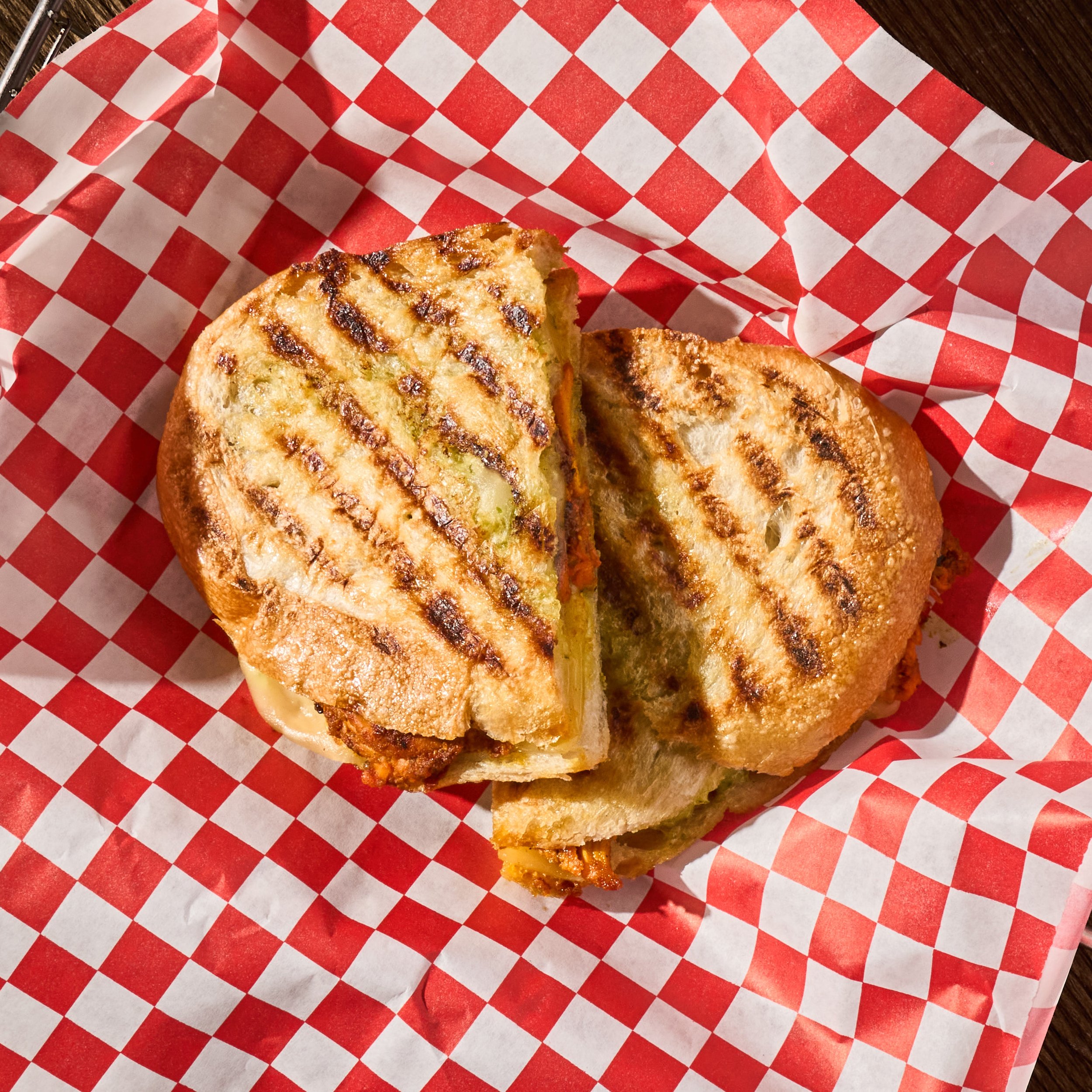 Grilled sandwich on checkered paper