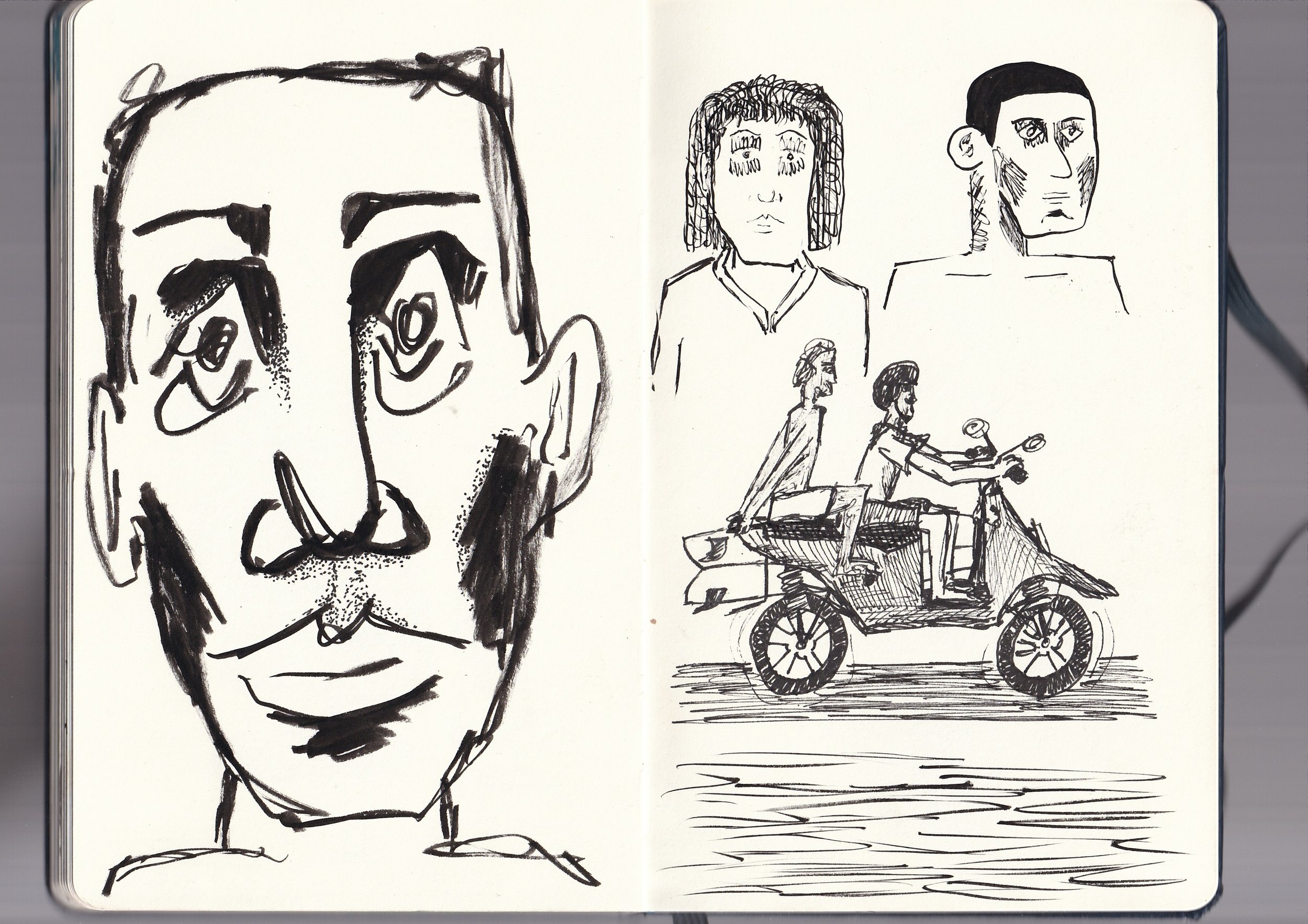 A large, detailed ink sketch of a human face on the left page and a collection of smaller sketches on the right page, including a person with curly hair, a person with straight hair, and two people riding bikes.