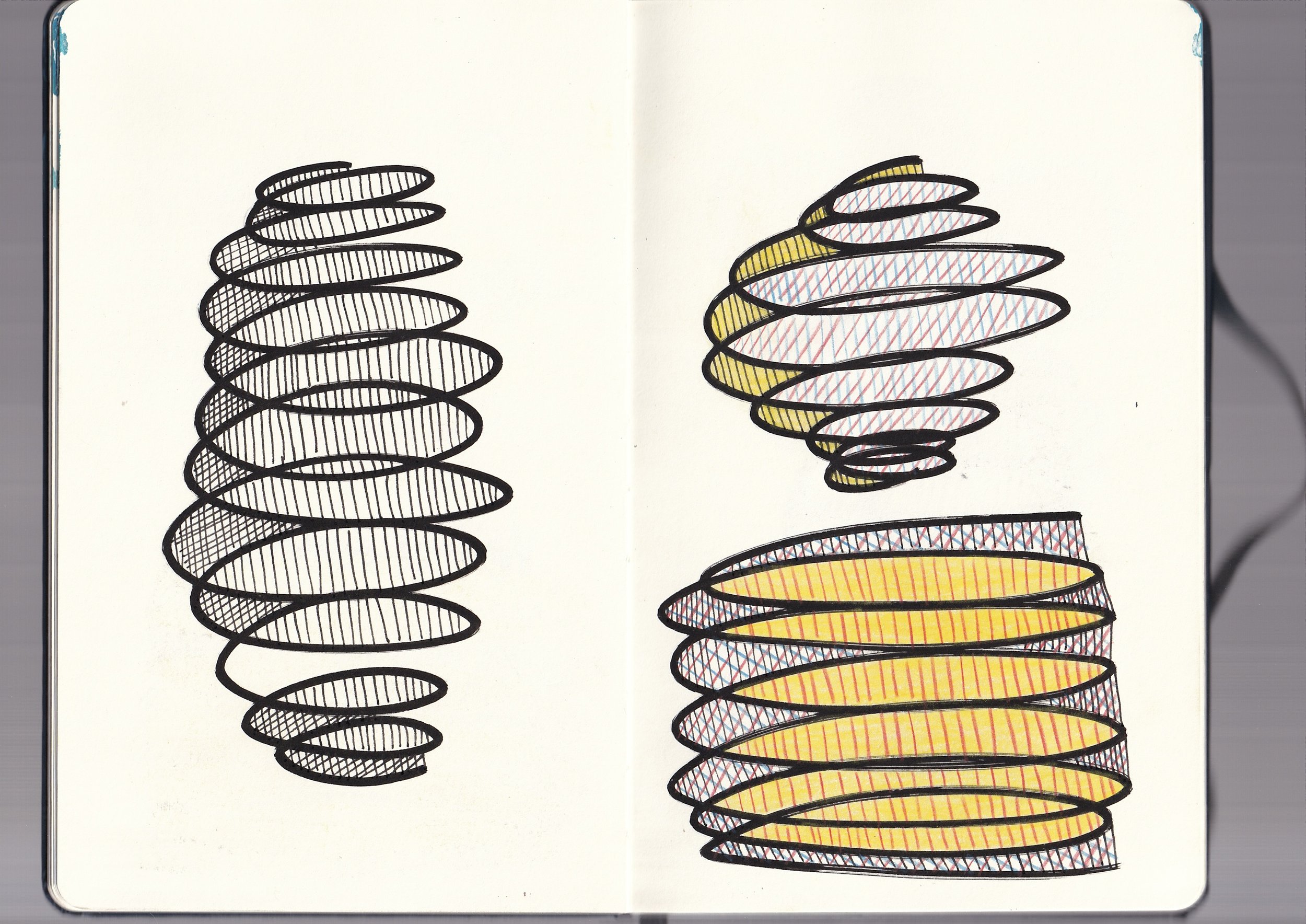 Sketch of two spools, one on the left with black lines and shading, and one on the right with colored patterns of red, yellow, and blue skewed lines.