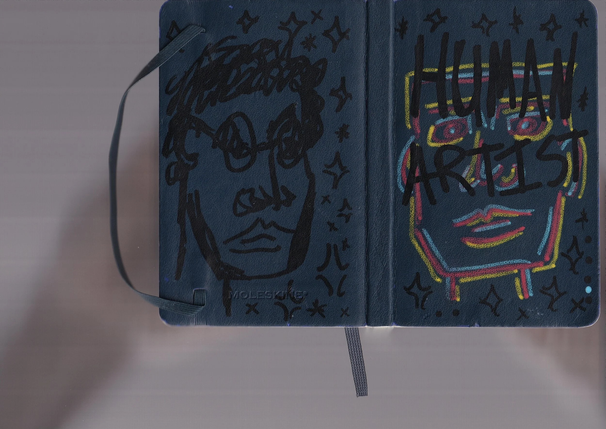 A colorful, illustrated notebook cover with the phrase "HAPPY HOLIDAYS" written in black marker, surrounded by vibrant, neon-like outlines of a snowman and various decorative elements. The notebook is secured with a gray elastic band.