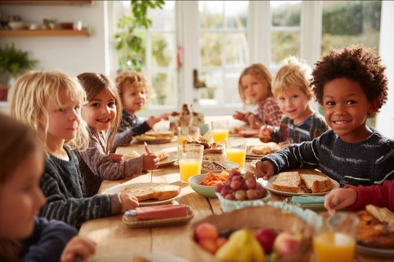 Children enjoying donated meals. Thanks to Women for Canada