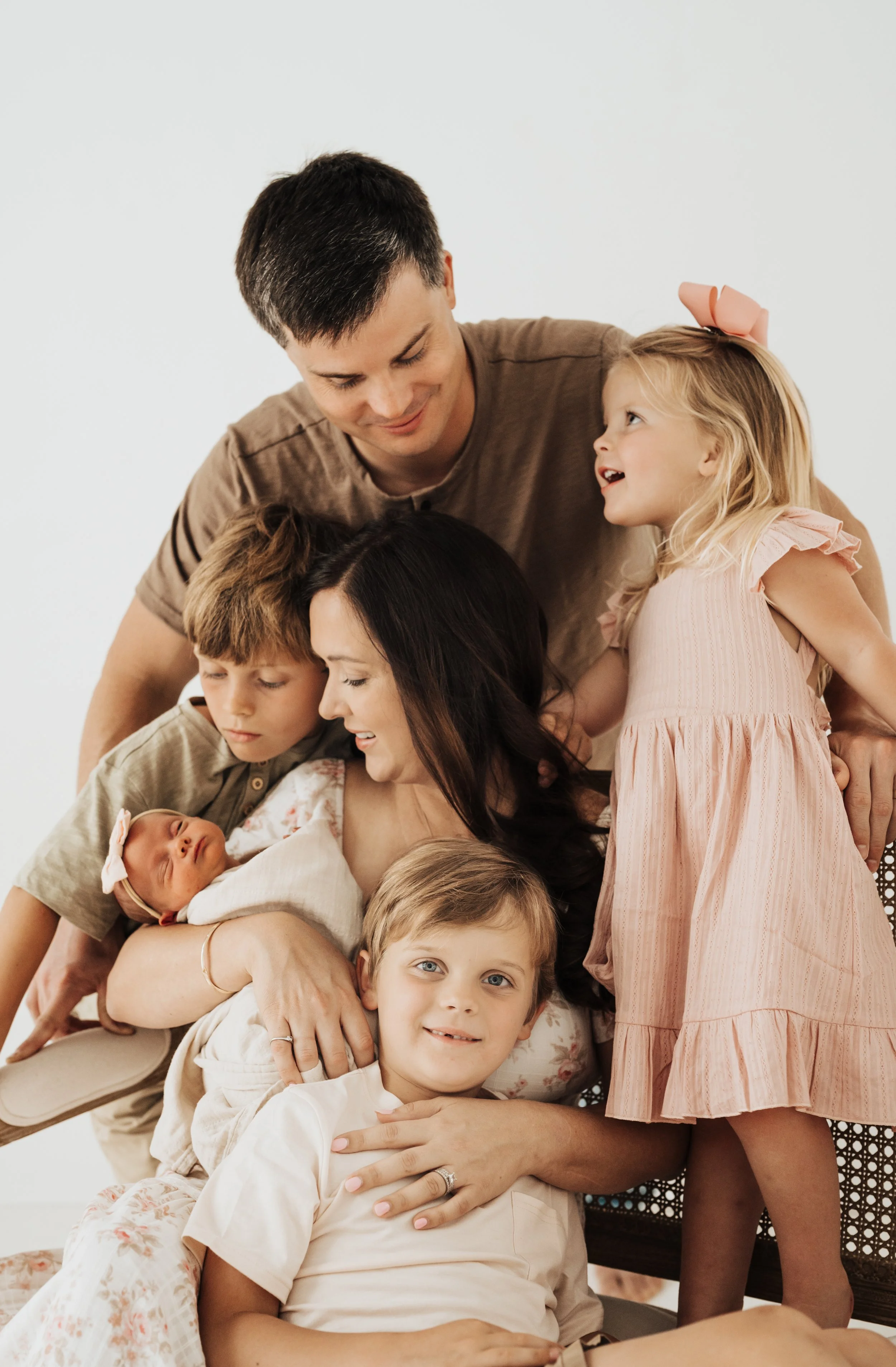 a family at a studio newborn session