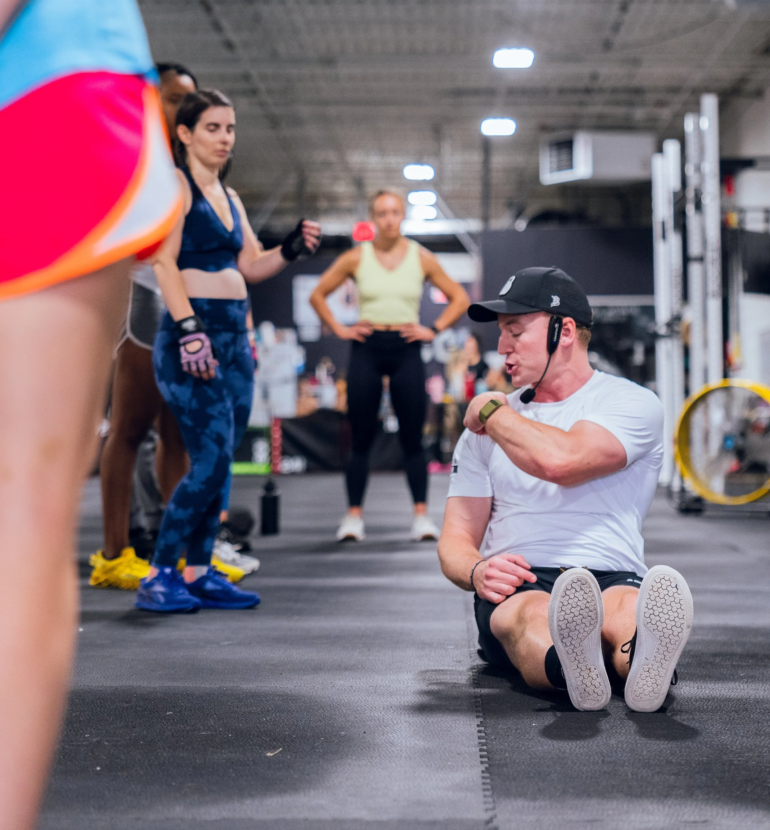 There's a reason our coaches are going to make you squat below parallel - and it's NOT about competition