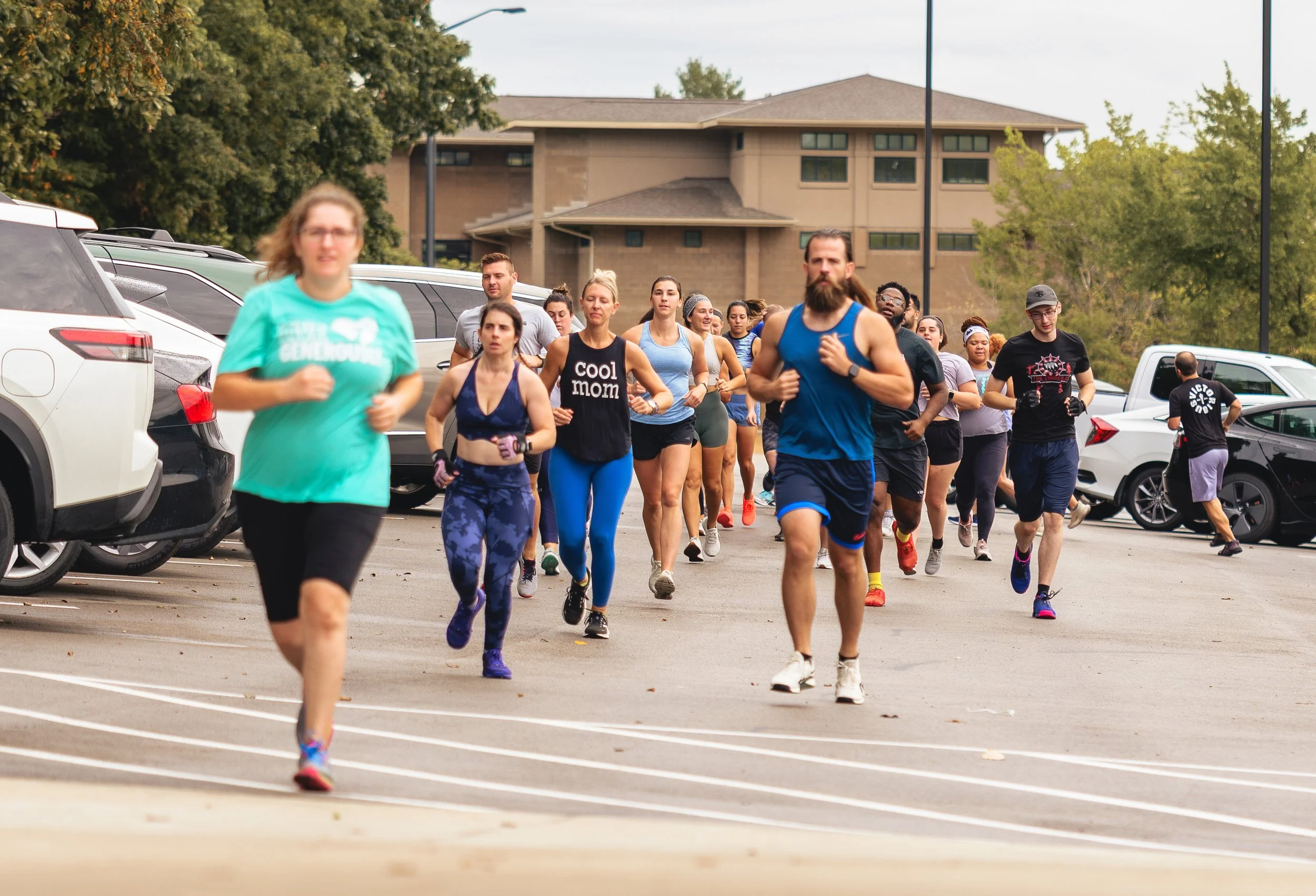 Members running together outside the gym