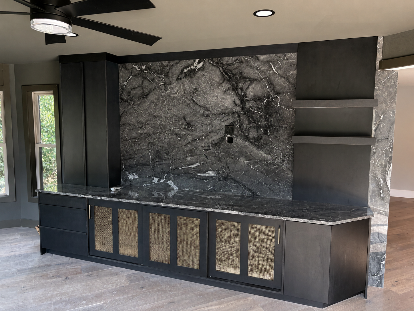Custom dog kennel cabinets with large marble backsplash.png