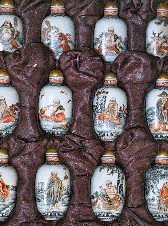 Stacked decorative ceramic vases in brown cloth with traditional Asian paintings of monks and deities. This highlights Richelle Kokol's, expertise in Advisory & Consulting - Informed insight to support confident collection management decisions.