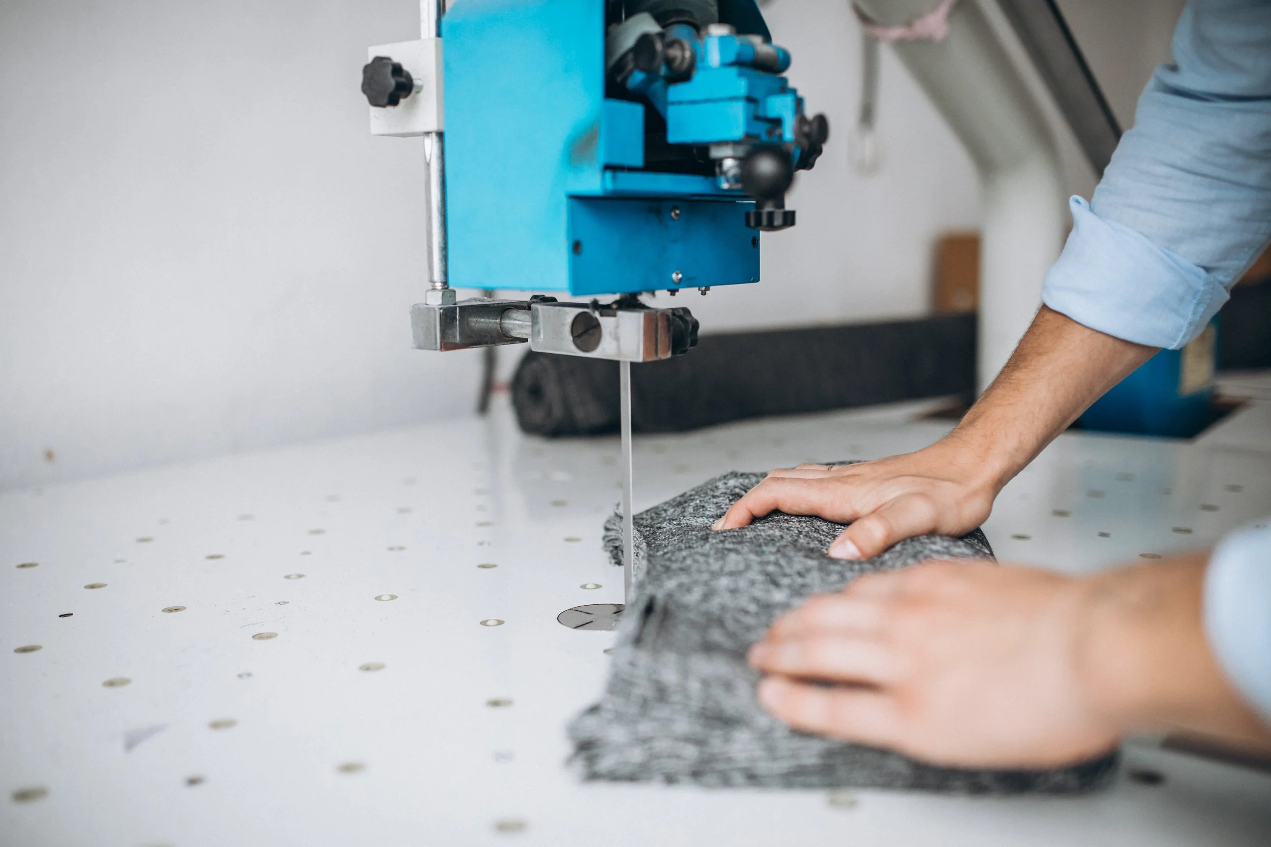 man-cutter-sewing-factory-male-hands-close-up.jpg
