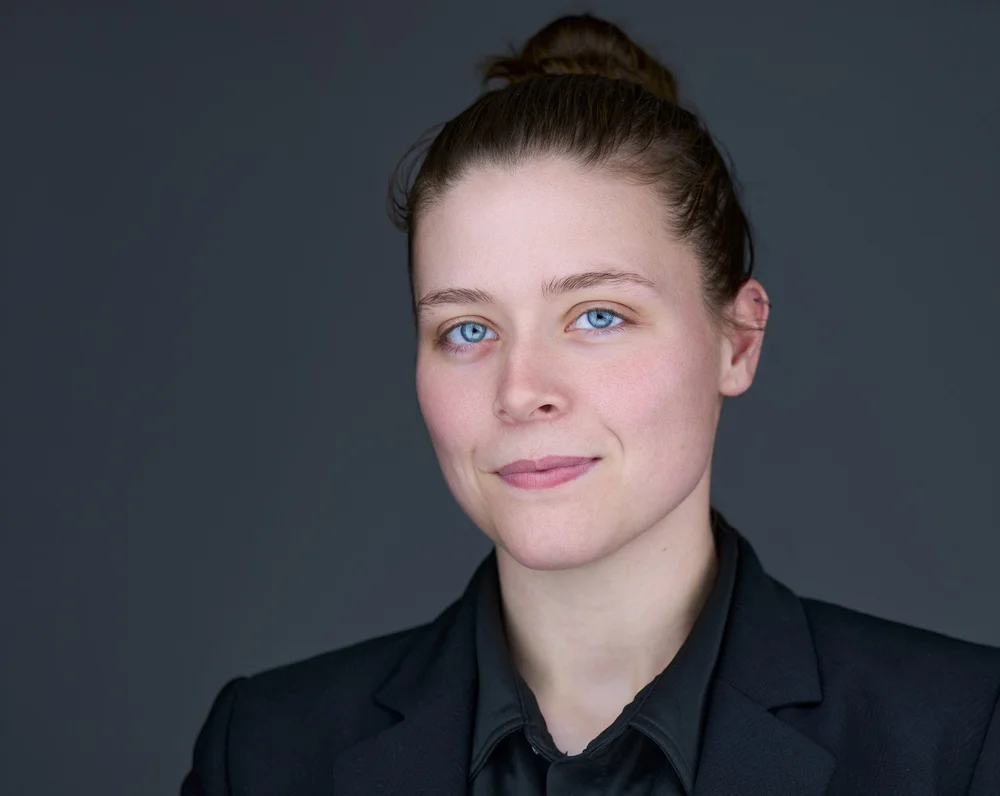 Executive headshot of a woman in a black blazer, business headshots Syracuse