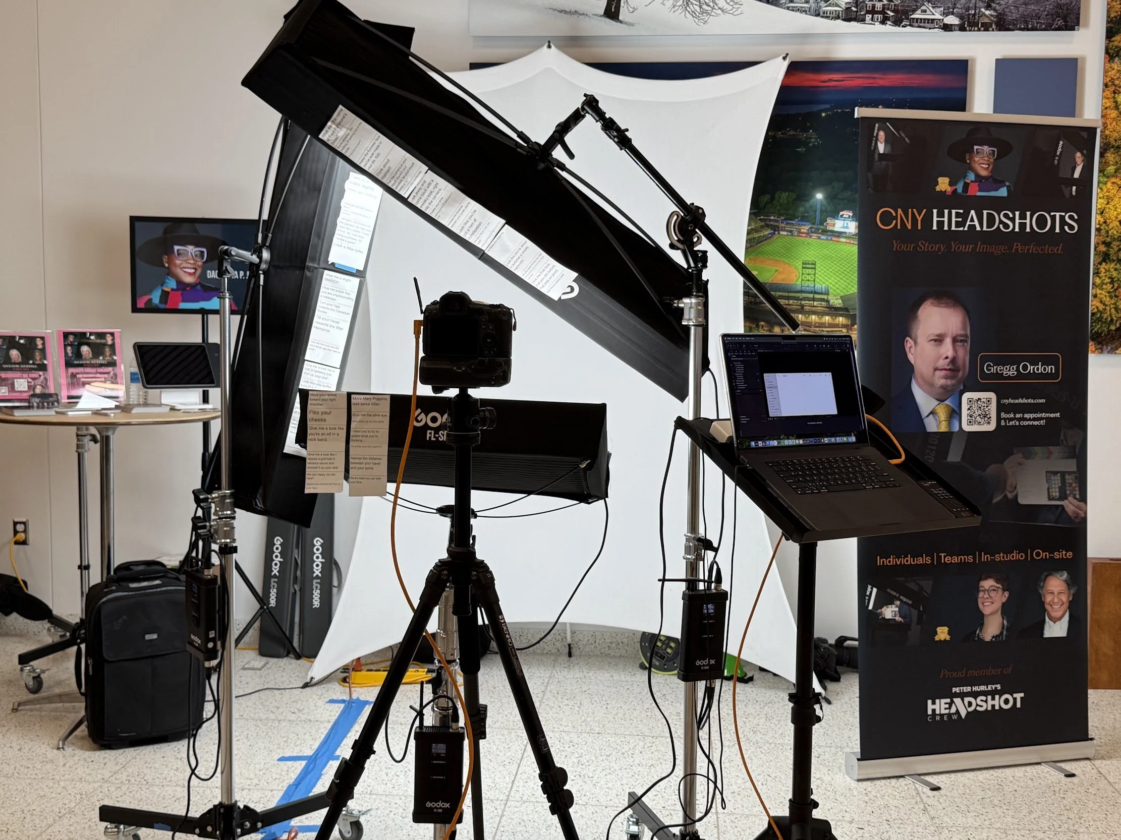 CNYHEADSHOTS on-site headshot setup with studio lighting, camera and tethered laptop