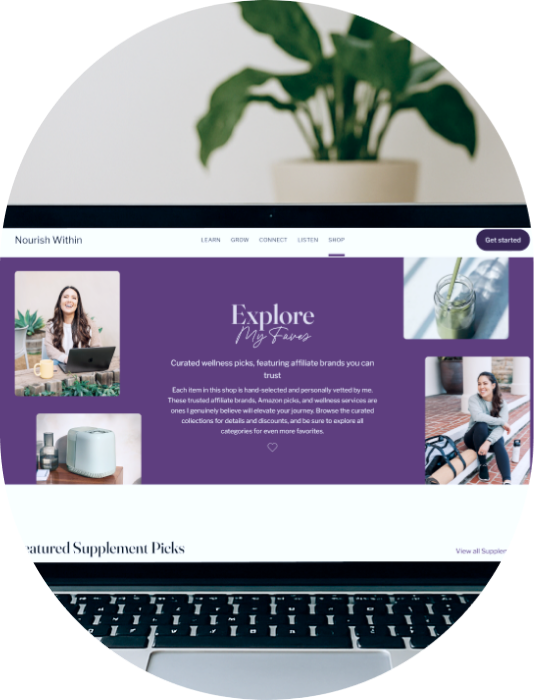 A computer screen displaying a wellness website called 'Nourish Within' with images of a woman, wellness products, and a smoothie, partially obscured by a potted plant.