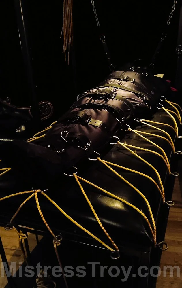 Bound with Leather Straps and Yellow Rope