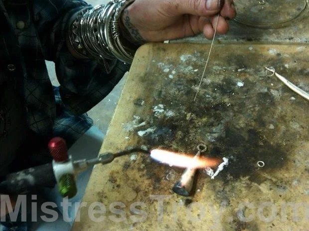 Jeweler using blow torch