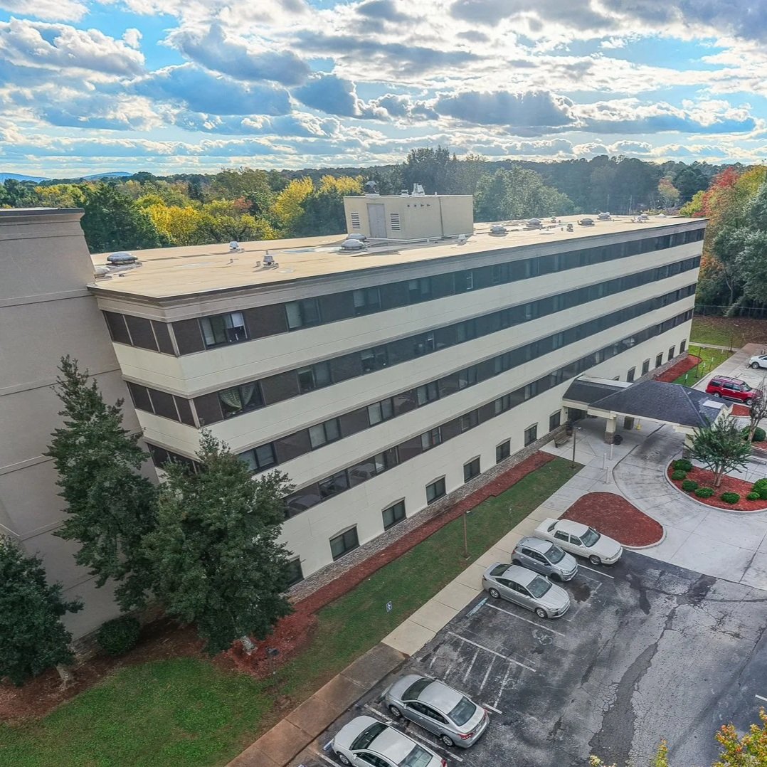 Exterior view of Huntsville Adventist in Huntsville AL, showing the building facade and surroundings.