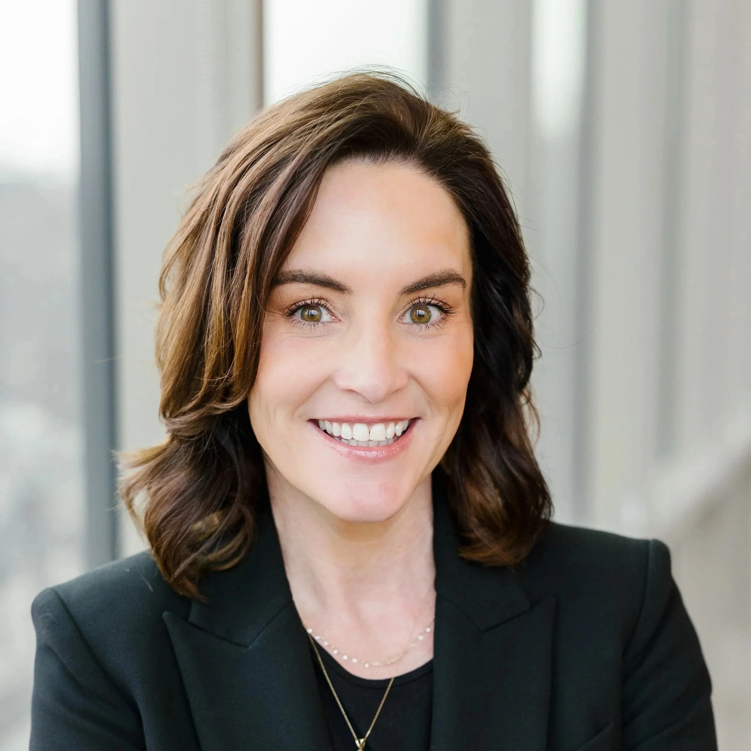 Headshot of Stephanie Lehman, President of Elmington Living at Elmington, featuring a clean background and professional attire