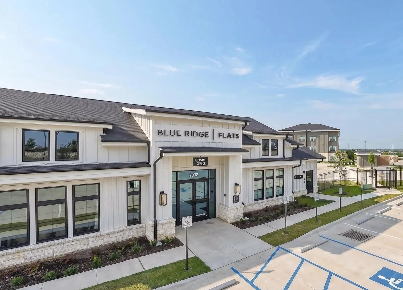 Exterior view of Blue Ridge Flats in Austin TX, showing the building facade and surroundings.