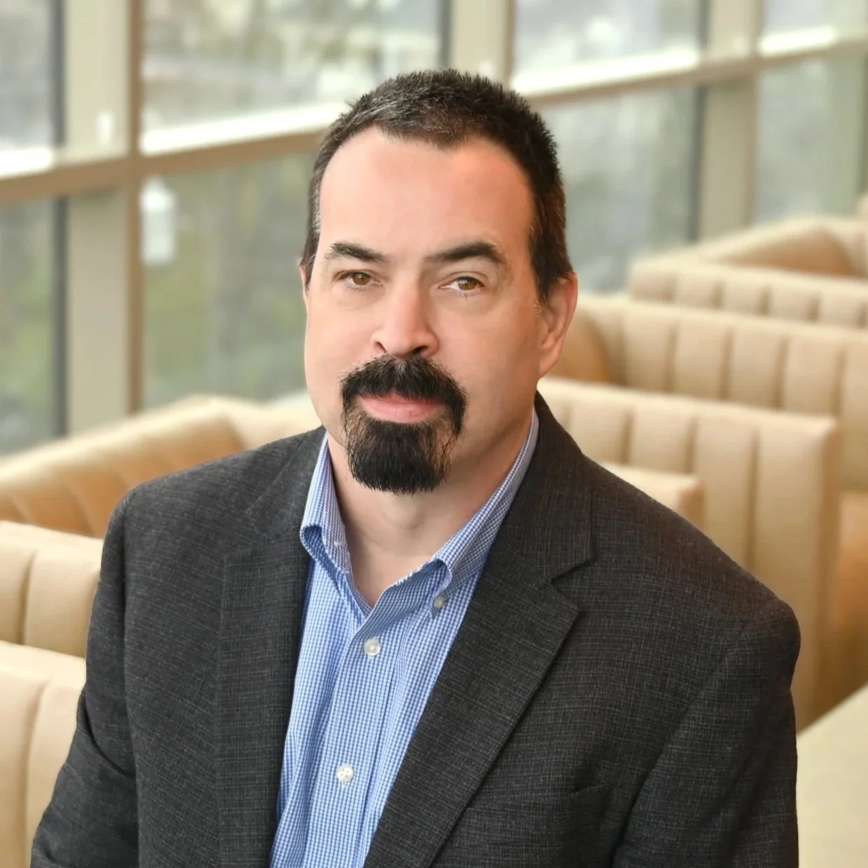 Headshot of Devin Smith, Vice President of Information Technology, featuring a clean background and professional attire