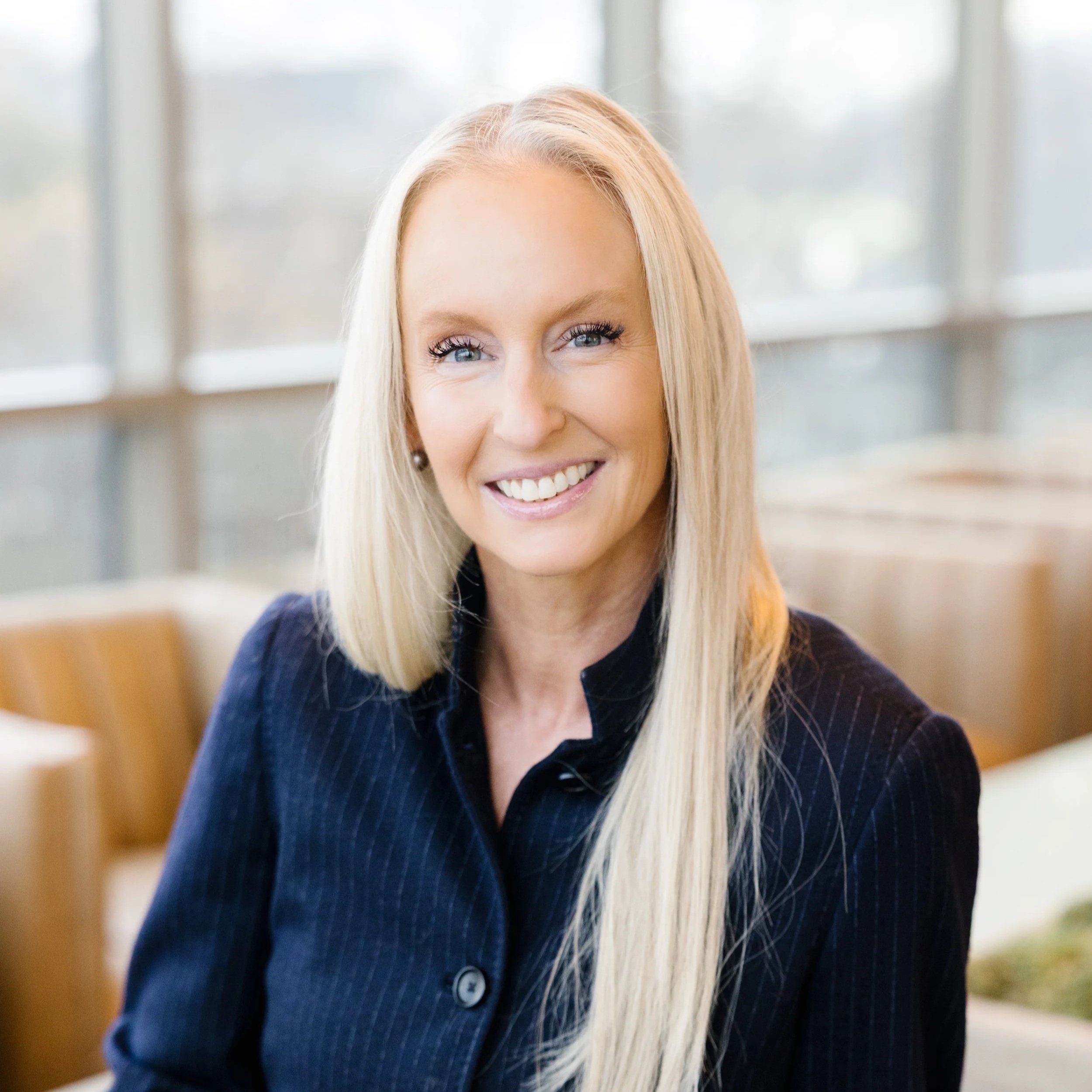 Headshot of DeAnna Moore, President of Elmington Property Management, featuring a clean background and professional attire