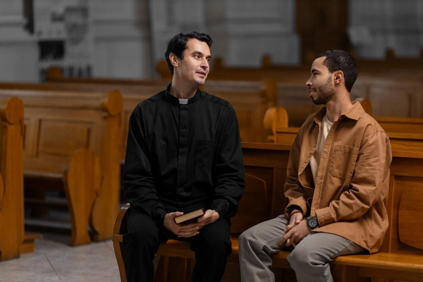 Church visitor talking with pastor