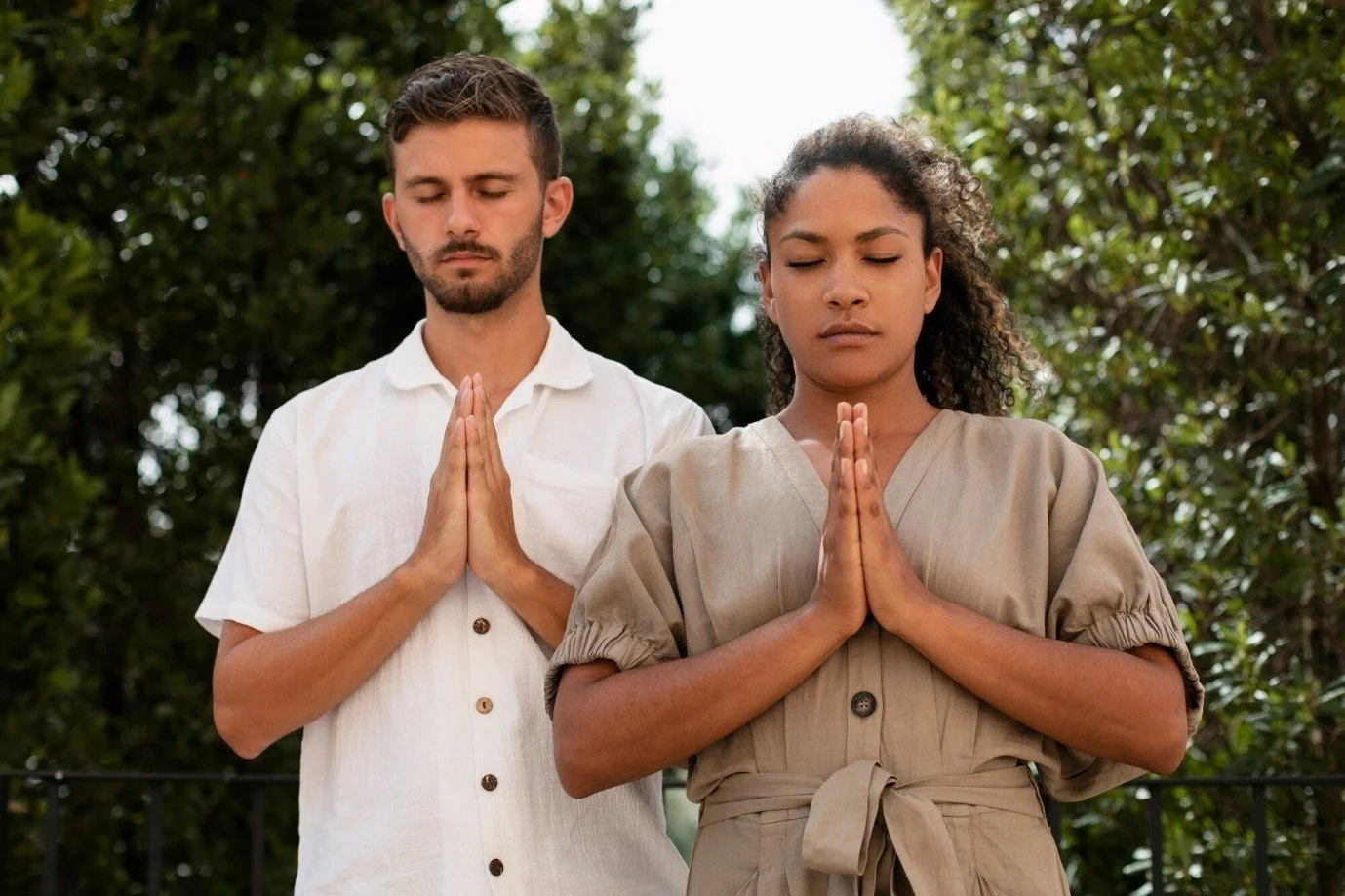 Medium shot of people praying together