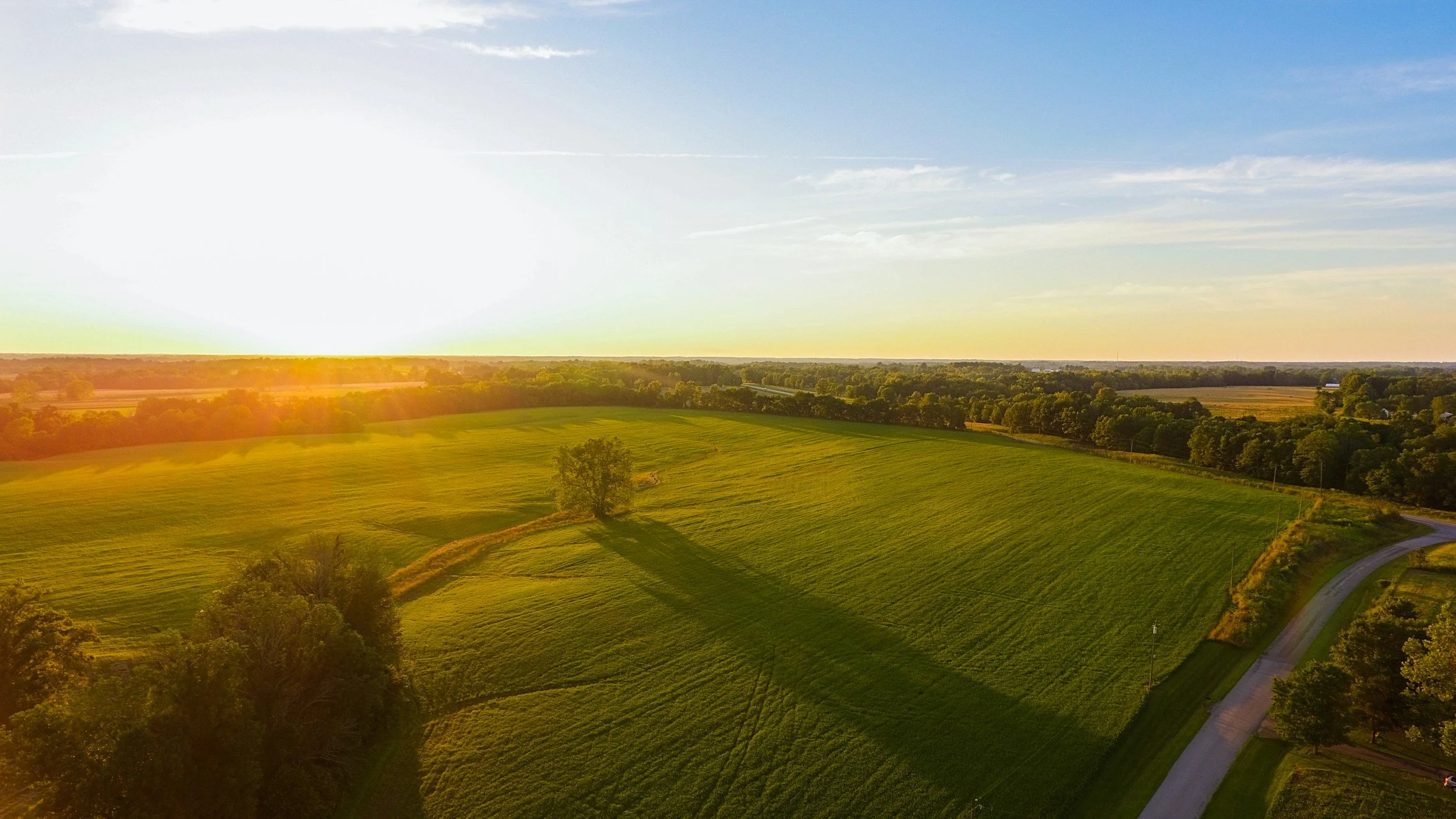 Country side field with beautiful orange sunset in Ohio