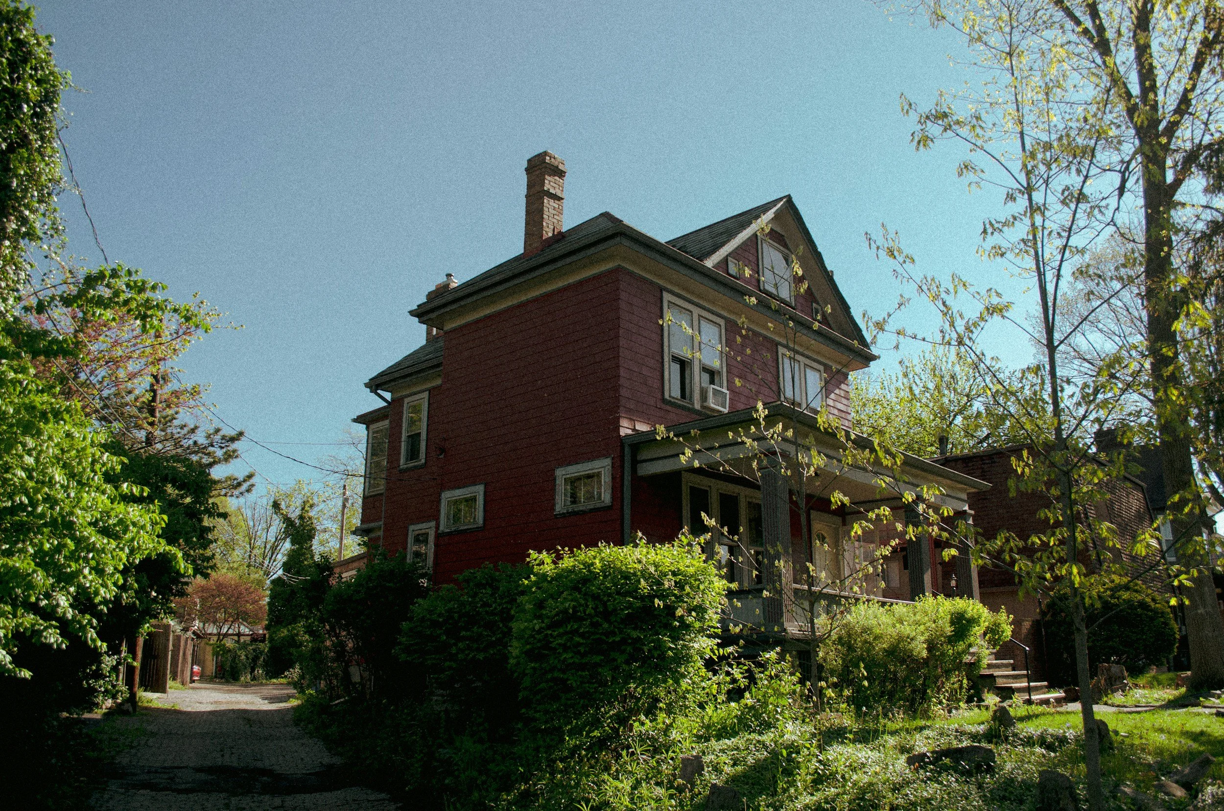 Picture of a Red brick house with black roof
