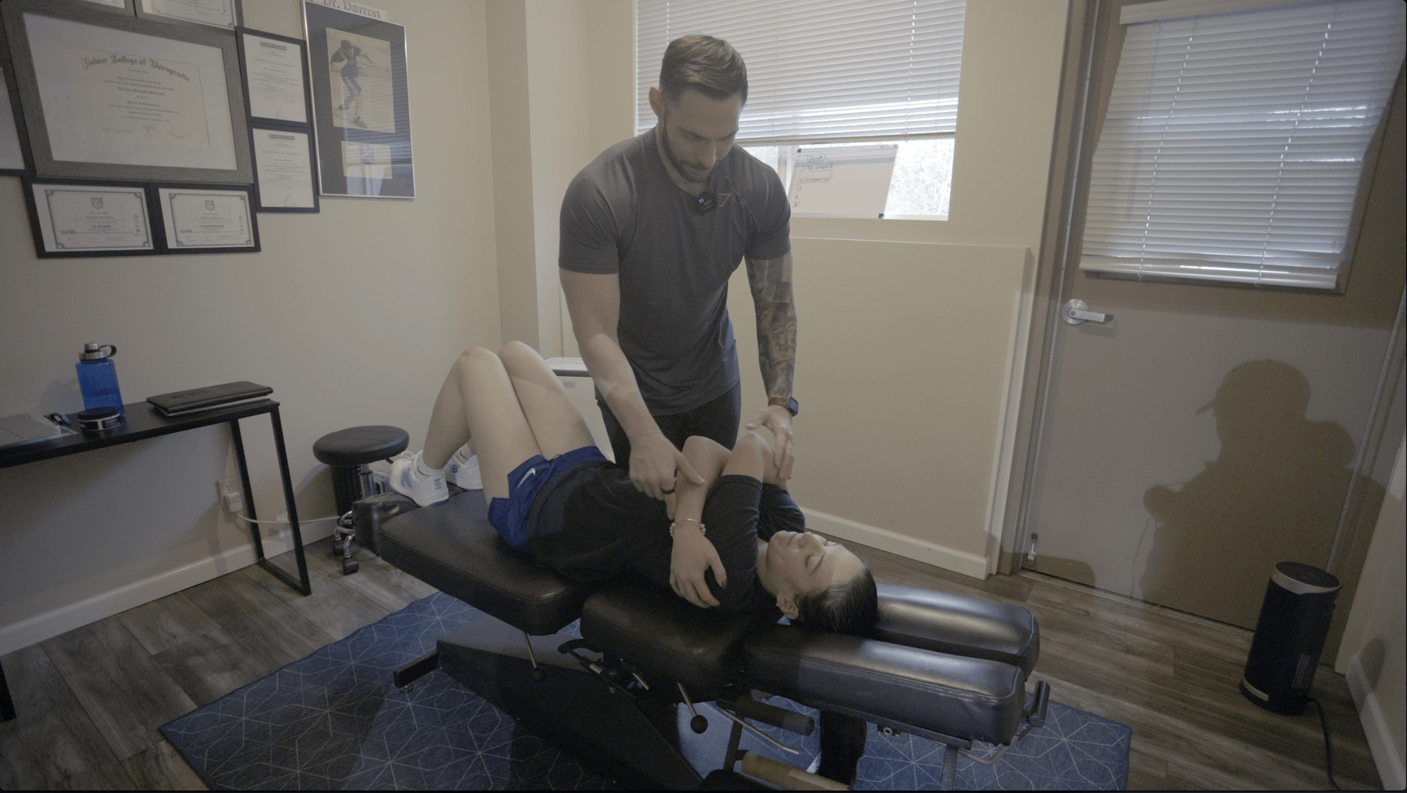 Dr. Derron adjusting a patient in a treatment room