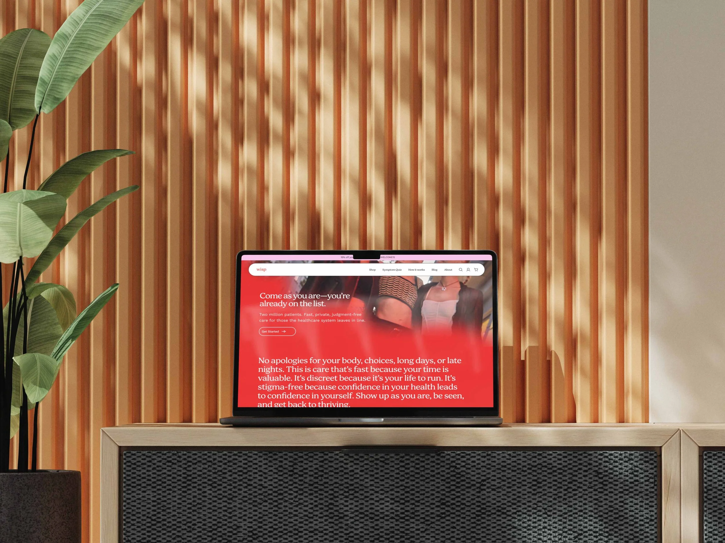 Wisp campaign landing page on a laptop screen