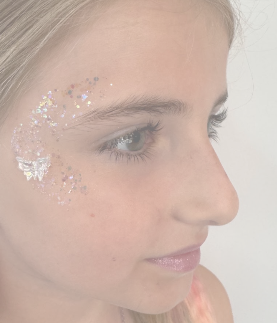 Magical glitter tattoo applied to a young princess at Clarendon Hills kids’ Glow Up
