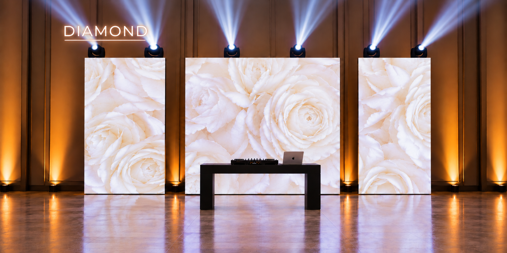 Diamond DJ package setup featuring floral LED video walls, DJ booth, and professional stage lighting.