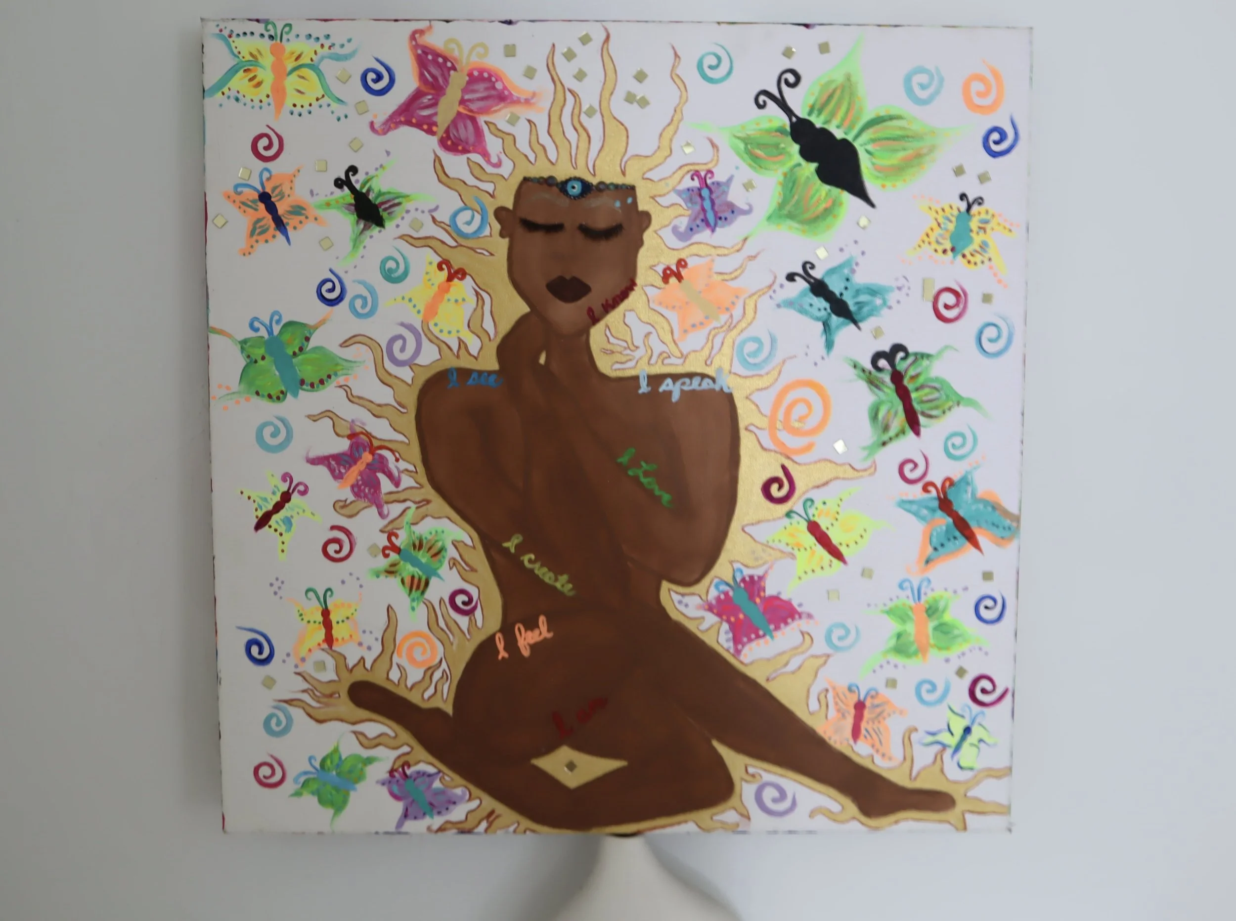 Chocolate Goddess  · 
Medium:
Acrylic and metallic paint on canvas  · 
24" x 24 x 2"   · 
Year:
2023
 · A celebratory portrait honoring strength, sensuality, and divine femininity through warm tones and luminous metallic highlights. The figure embodi