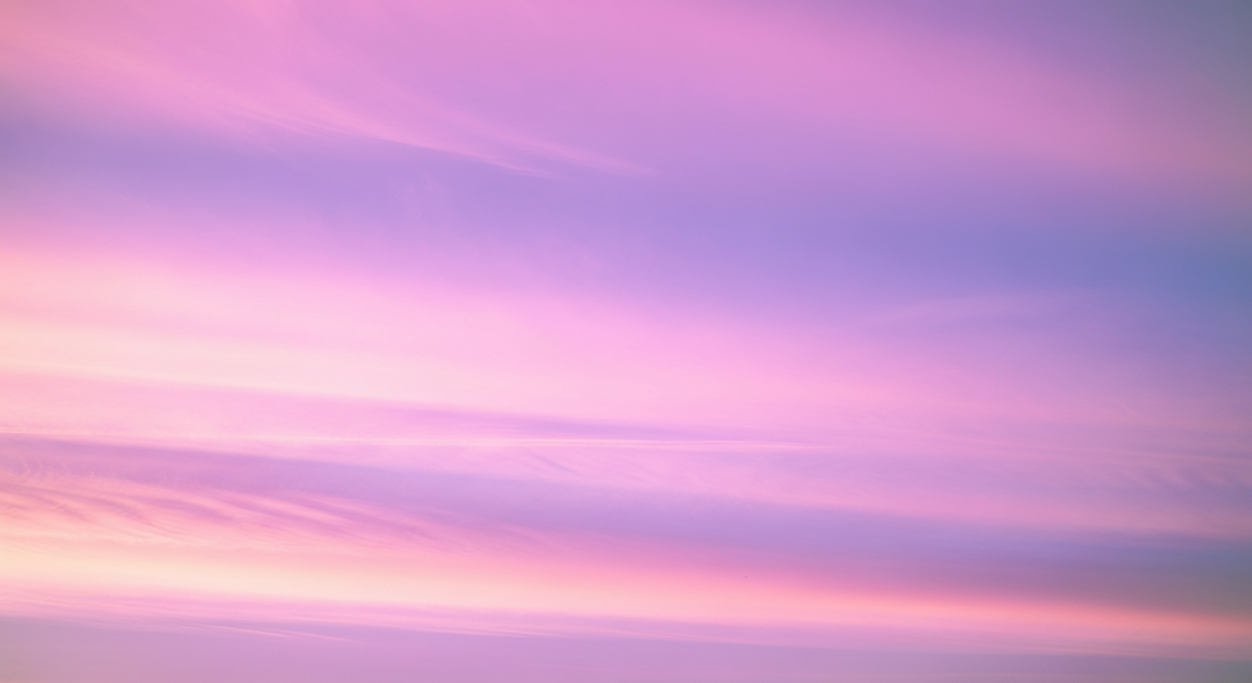 Pink and purple sunset sky with soft, wispy clouds.
