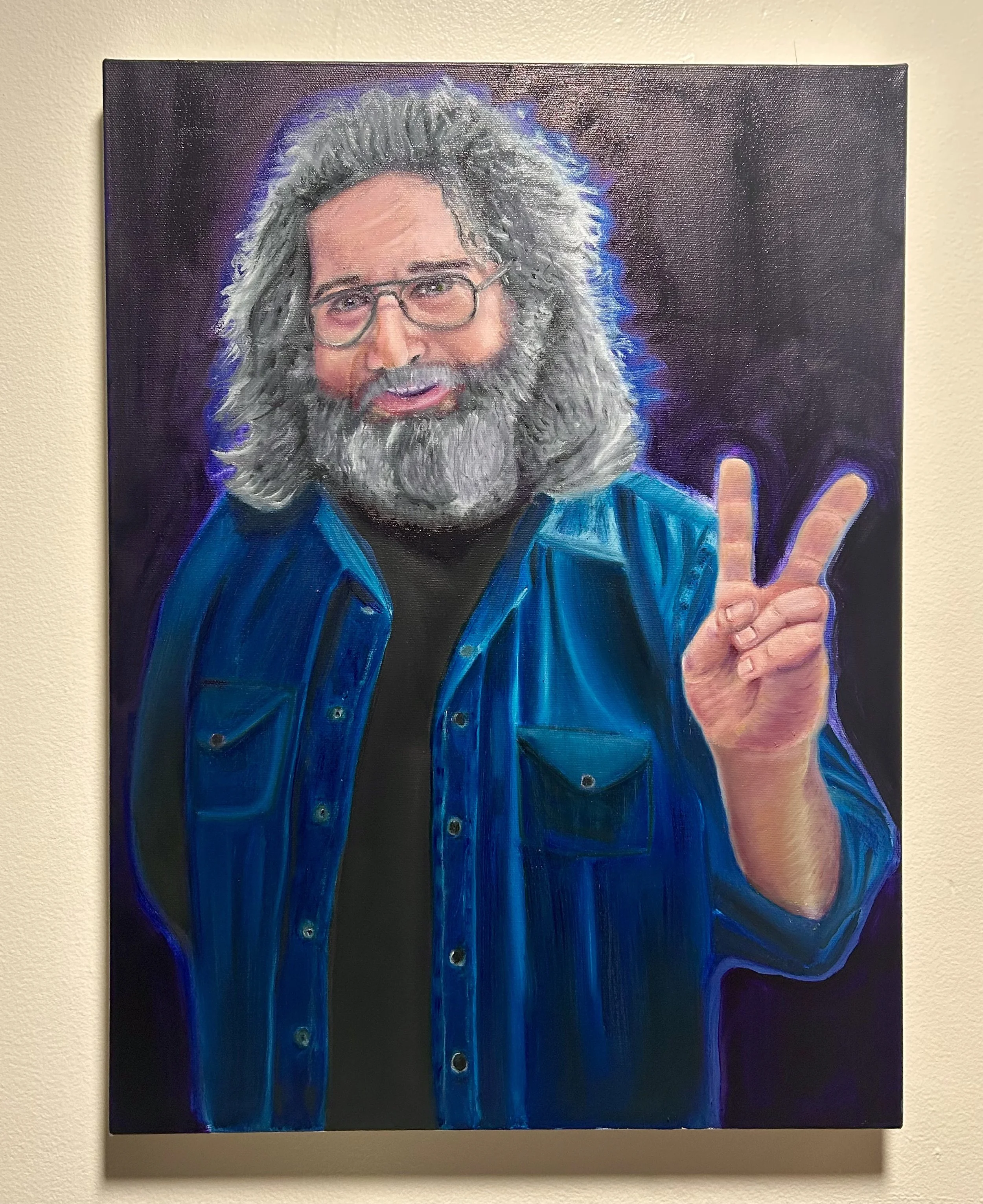 Painting of a smiling man with long gray hair and beard, wearing glasses and a blue shirt, holding up a peace sign with his right hand.