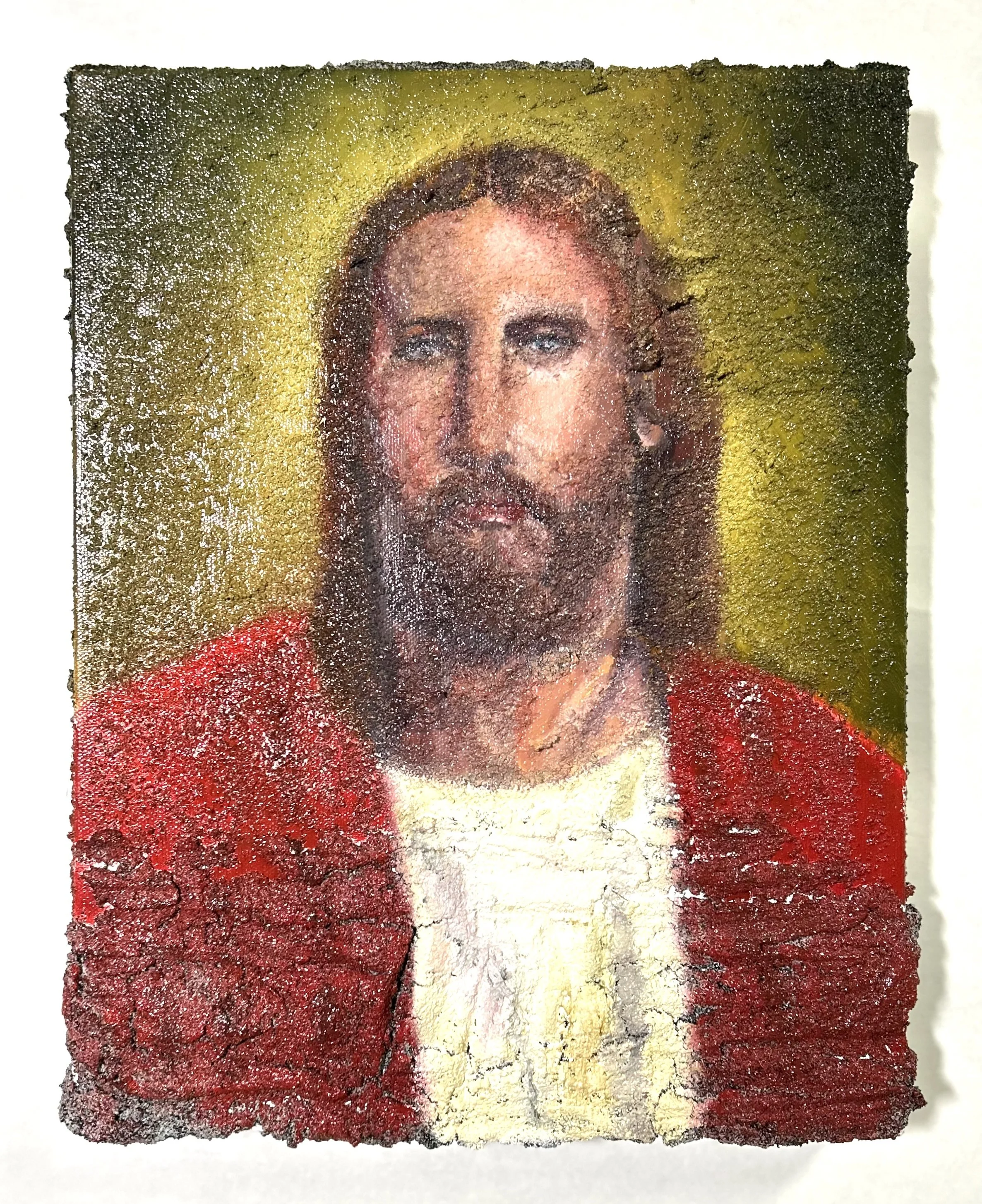 A worn, textured image of Jesus Christ with long hair and a beard, wearing a red robe and a white garment, with a faint golden halo behind his head.