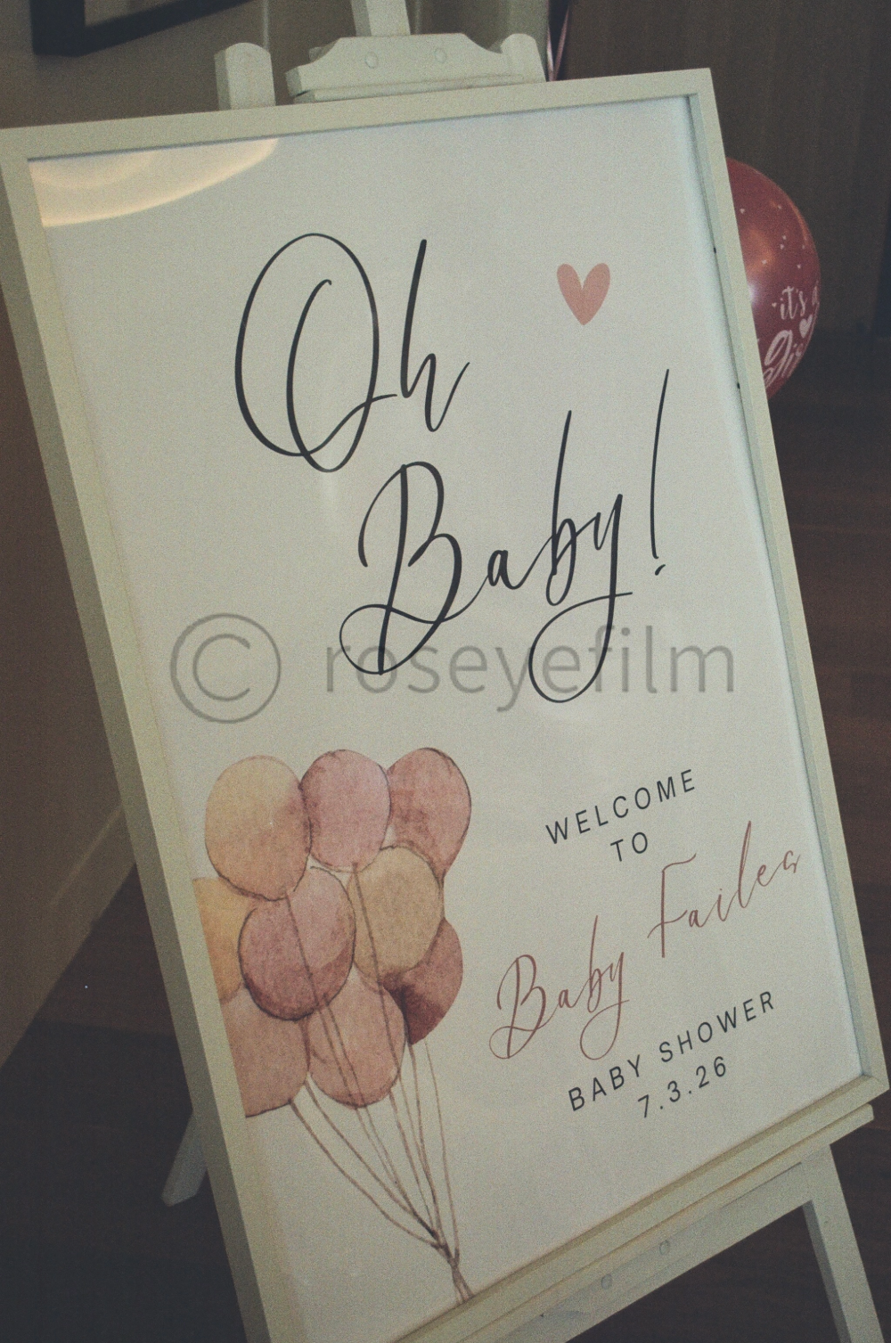 Welcome sign for a baby shower with pink and beige balloons and the text "Oh Baby!" and "Welcome to Baby Faiden" along with the date "7.3.26."