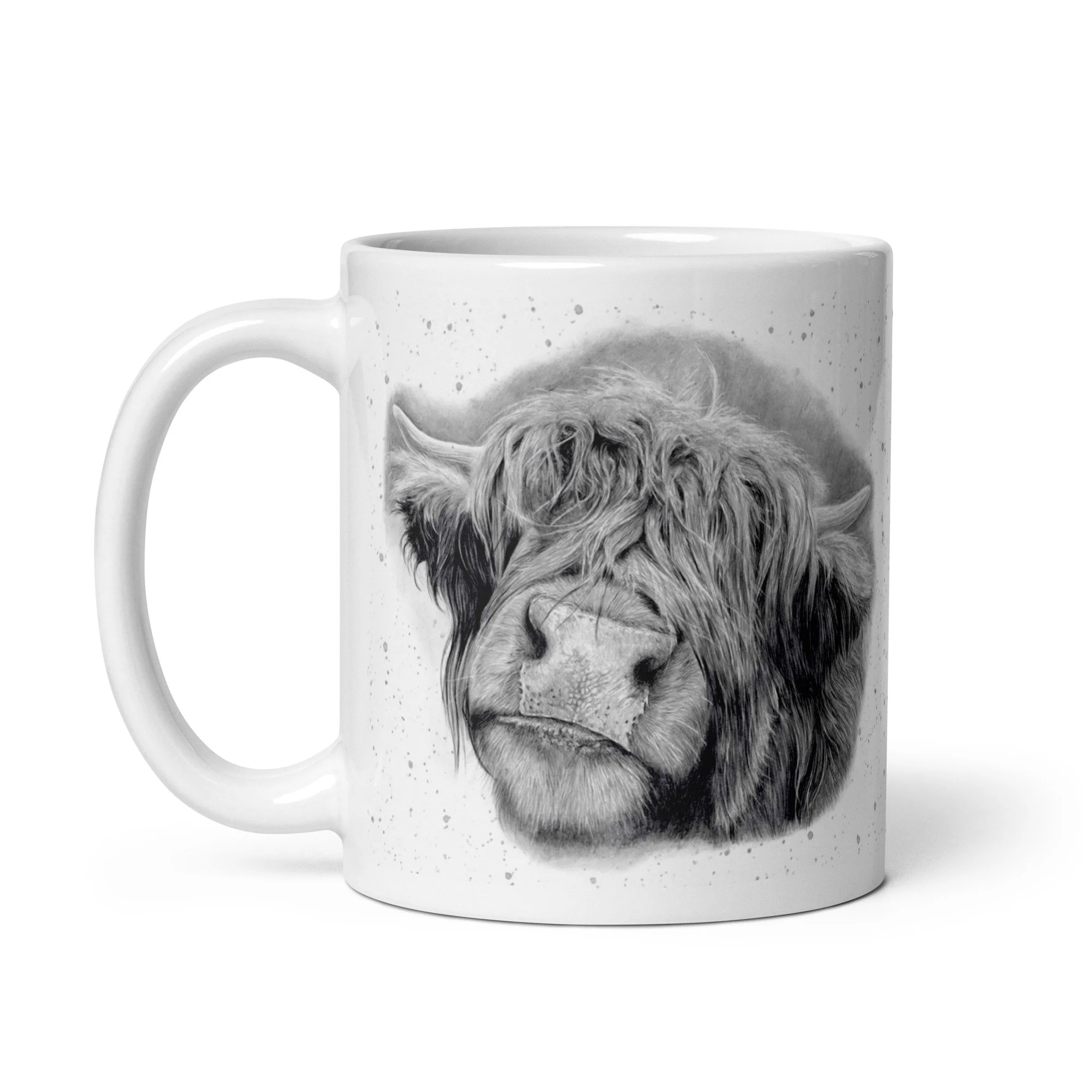 Side view of a Highland Cow ceramic mug showcasing original Highland Cow artwork with a grey fleck design by UK artist Matt Lloyd on a durable glossy white mug.
